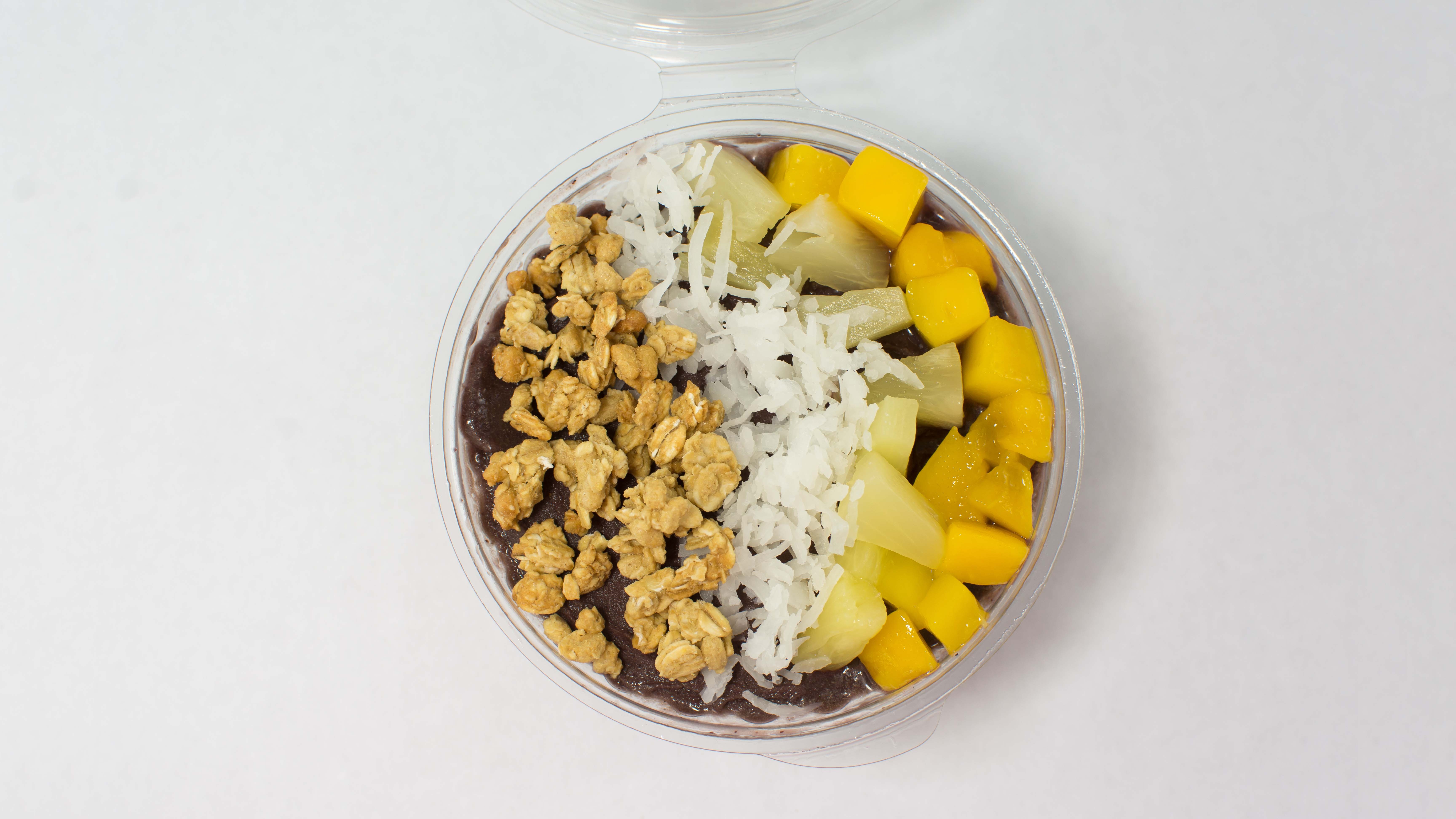 Order Tropical Coconut Acai Bowl food online from Orange Leaf Frozen Yogurt store, Lexington on bringmethat.com
