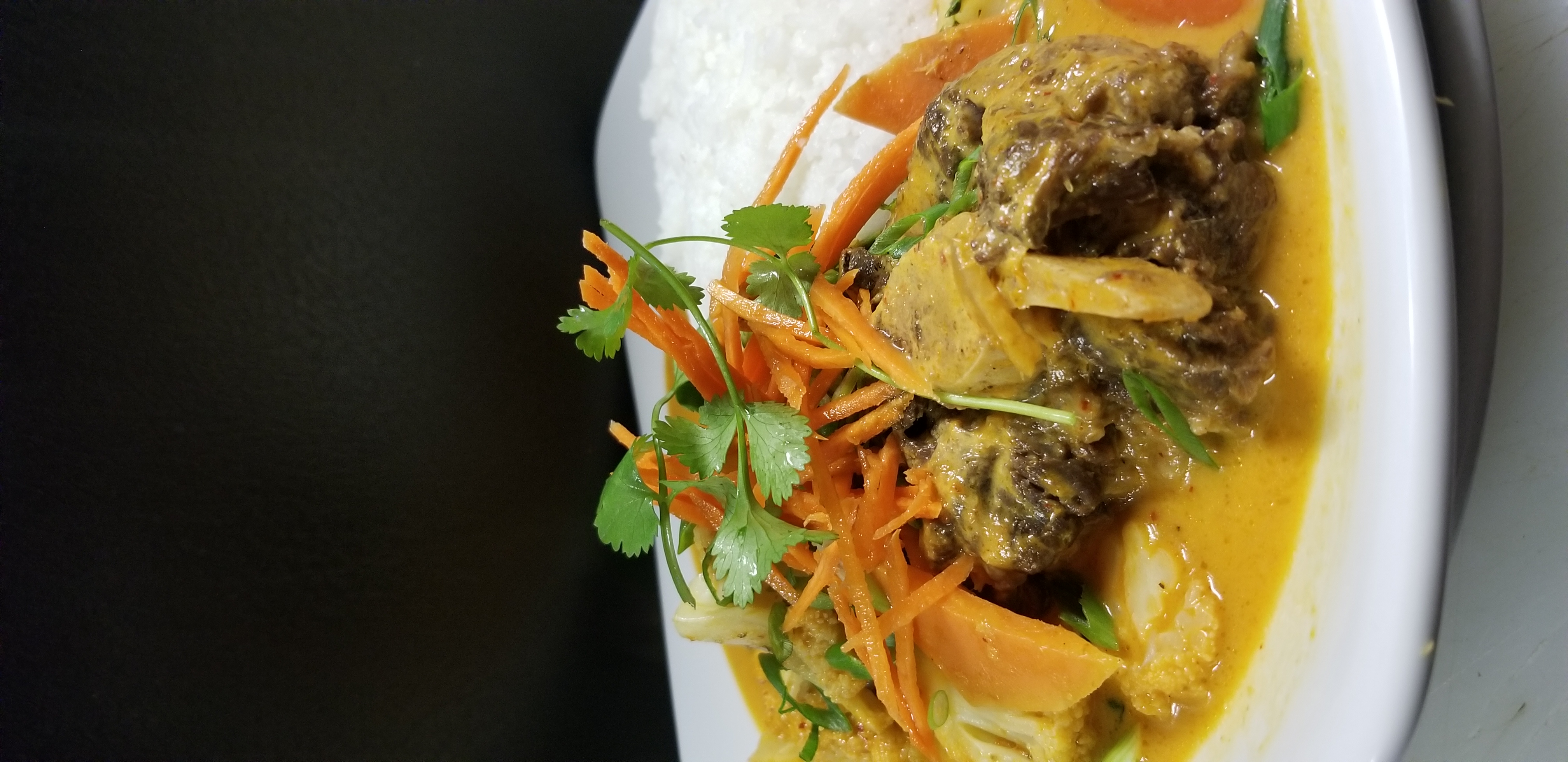 Order Oxtail Curry Rice Bowl food online from Wicked Pho store, El Paso on bringmethat.com