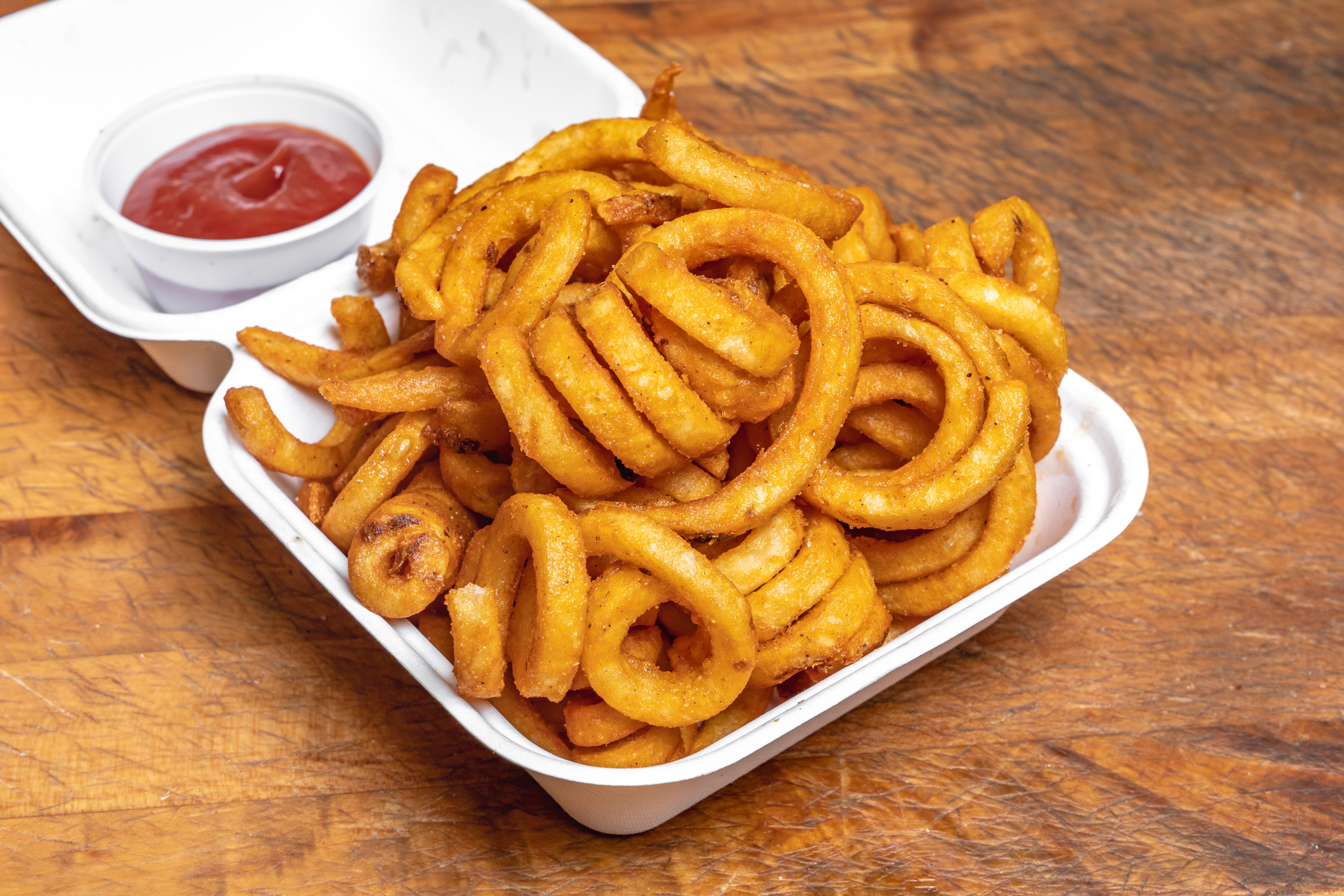 Order Curly Fries - Appetizer food online from Garden Pizza store, Milford on bringmethat.com