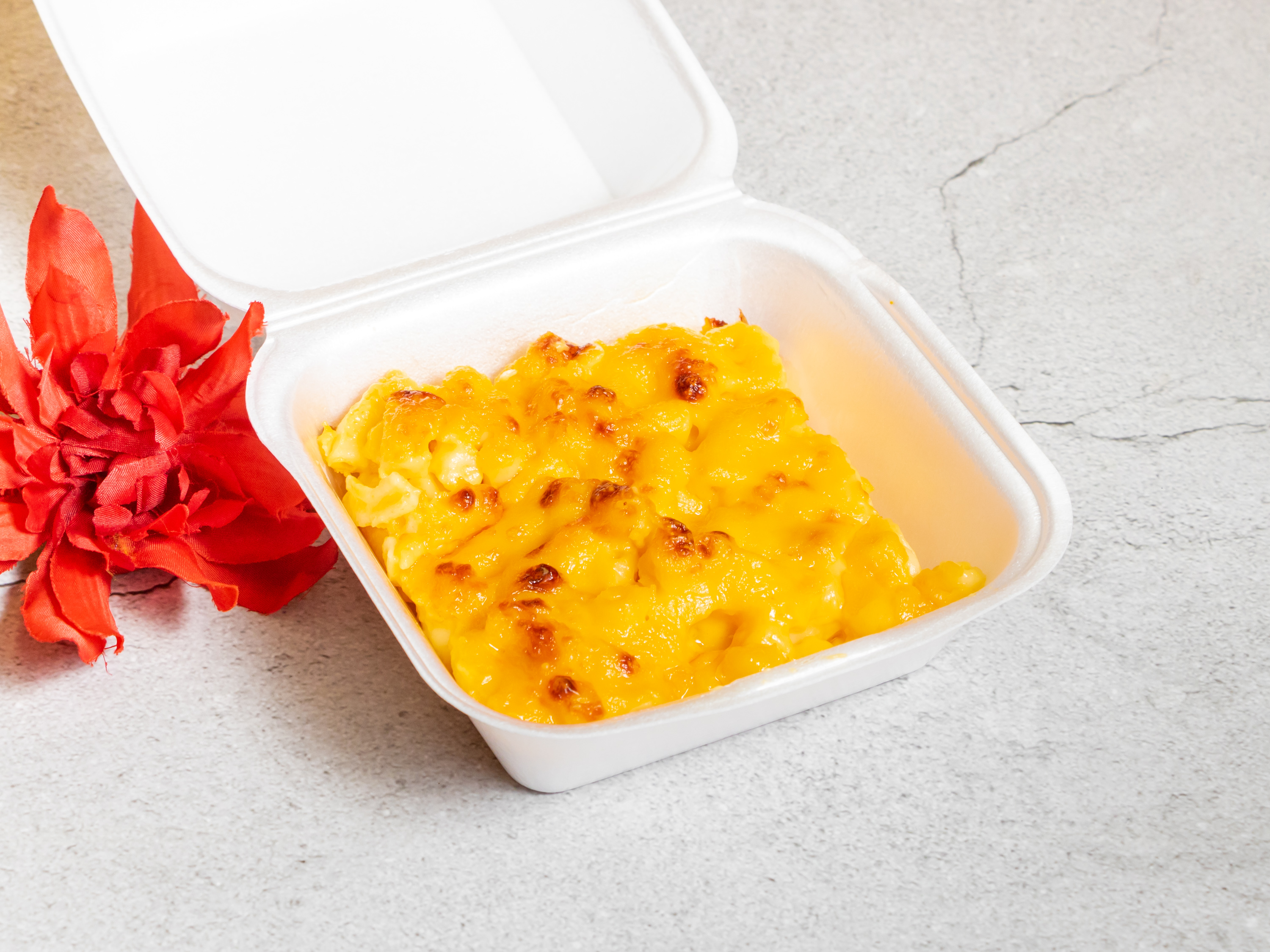 Order Mac and Cheese food online from M & K Jamaican store, Huntsville on bringmethat.com