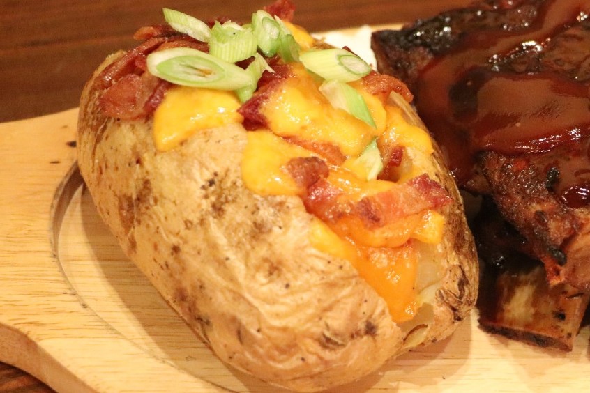 Order Loaded Baked Potato food online from The Simpson Restaurant & Bar store, Brooklyn on bringmethat.com