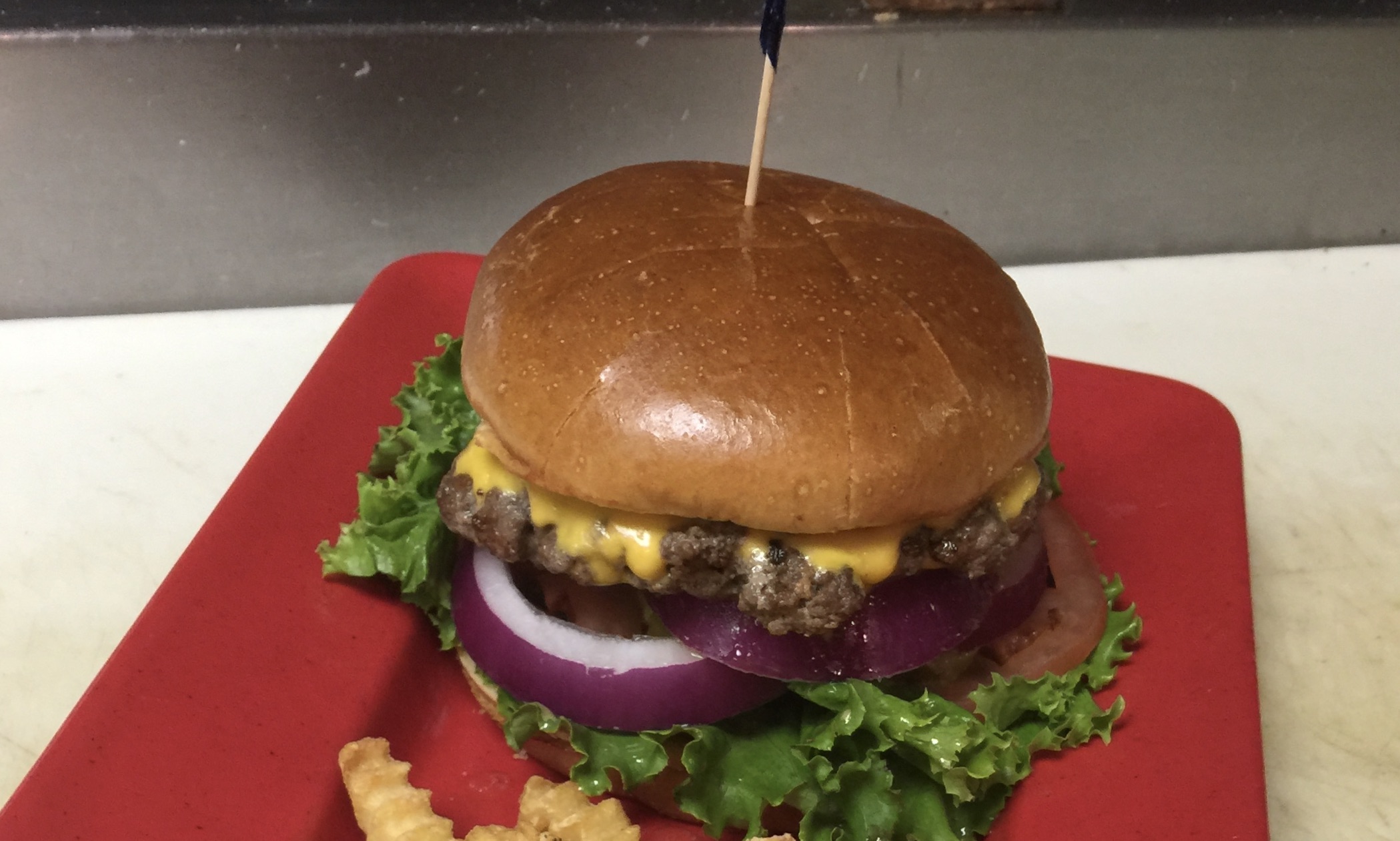 Order Wisconsin Cheesehead Burger food online from Tailgators store, Coralville on bringmethat.com