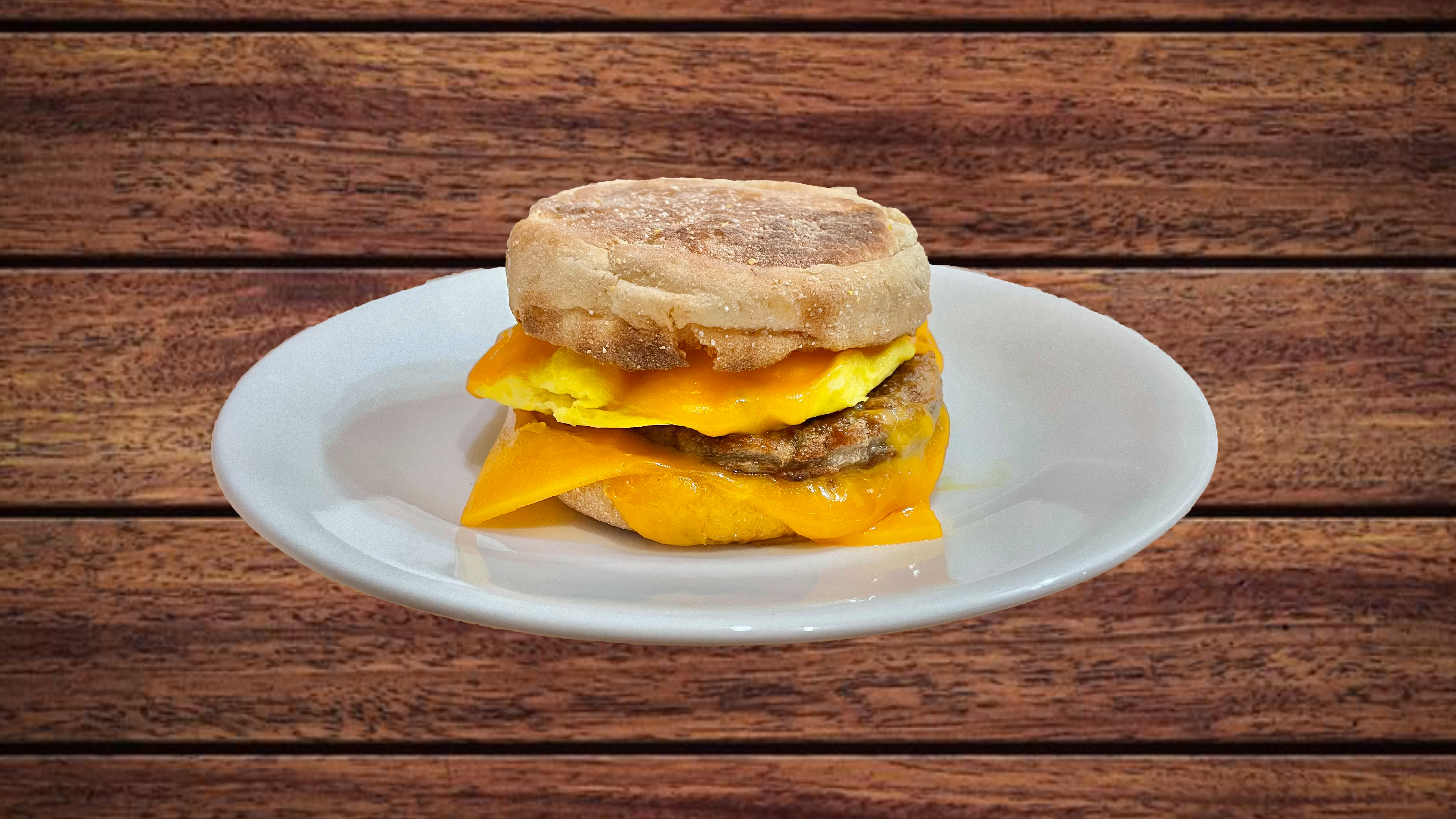 Order English Muffin with Egg, Cheese and Sausage food online from Glaze Donuts And Bagel Sandwiches store, San Francisco on bringmethat.com