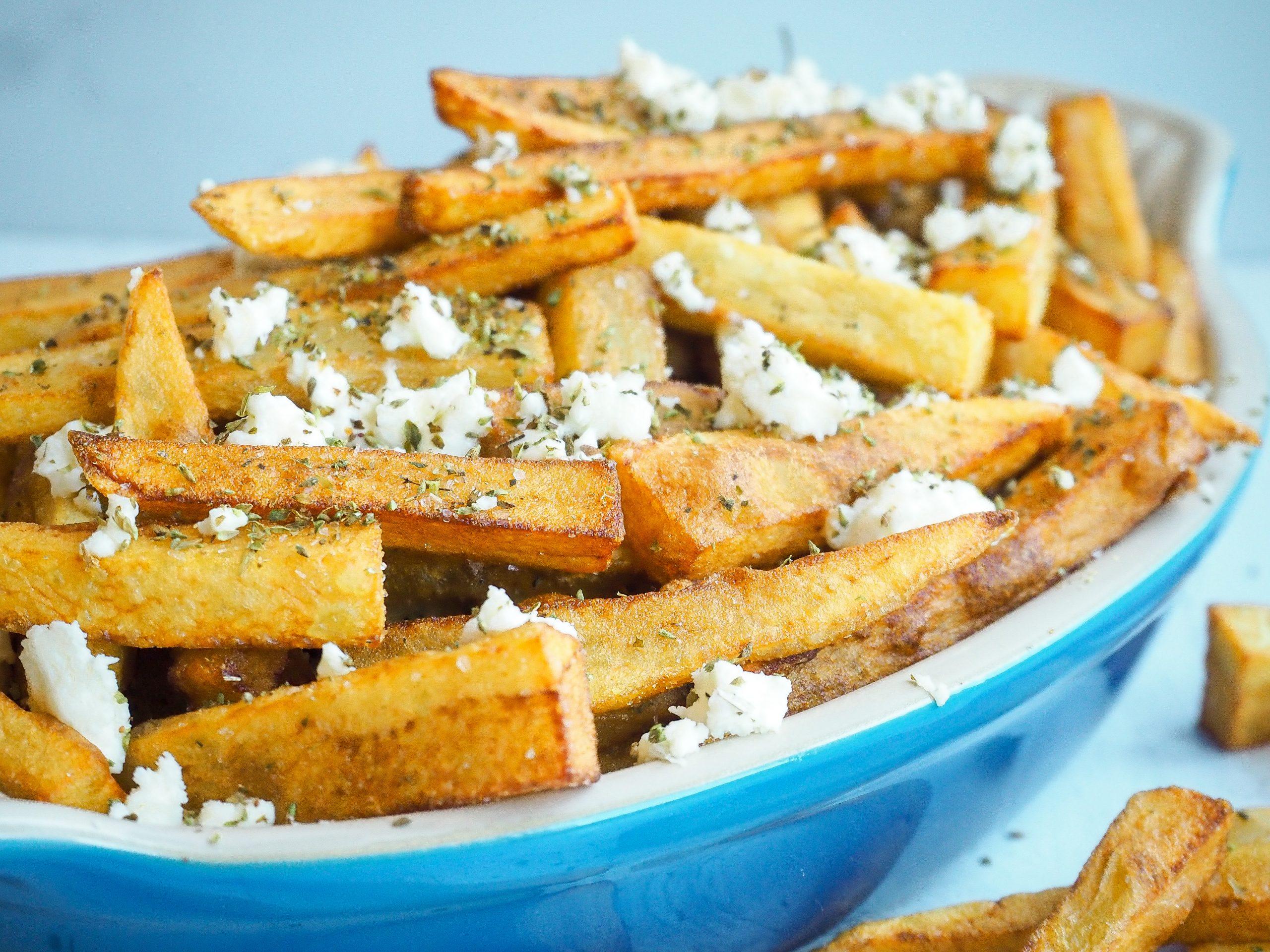Order Greek Fries (French Fries with Feta and Oregano) food online from Kimo Kitchen store, Rockaway Beach on bringmethat.com