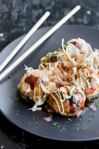 Order Takoyaki (Battered Octopus Ball) (4) food online from Jade Garden store, Lawrence on bringmethat.com
