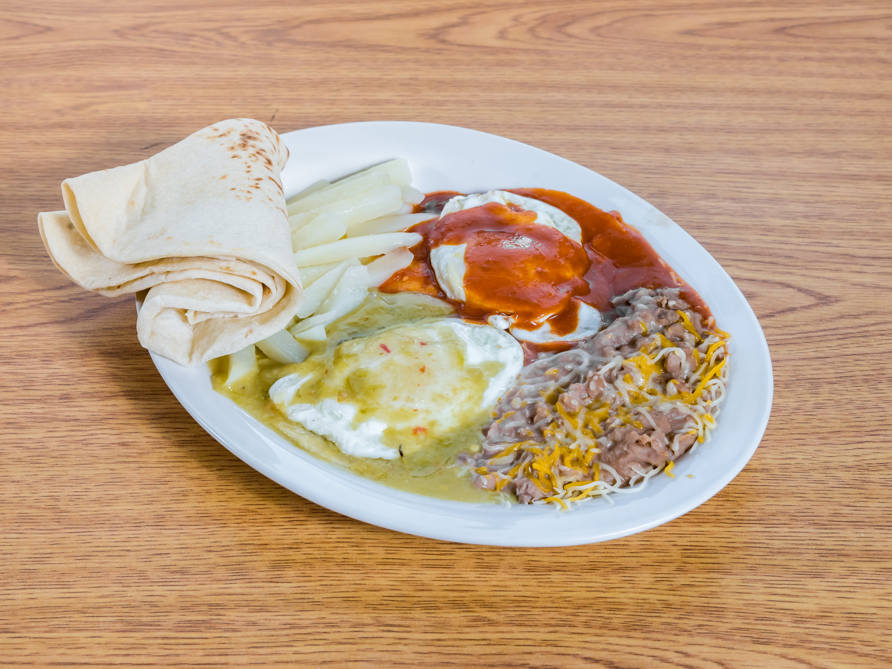 Order Huevos Rancheros Plate food online from Burrito Express store, Albuquerque on bringmethat.com