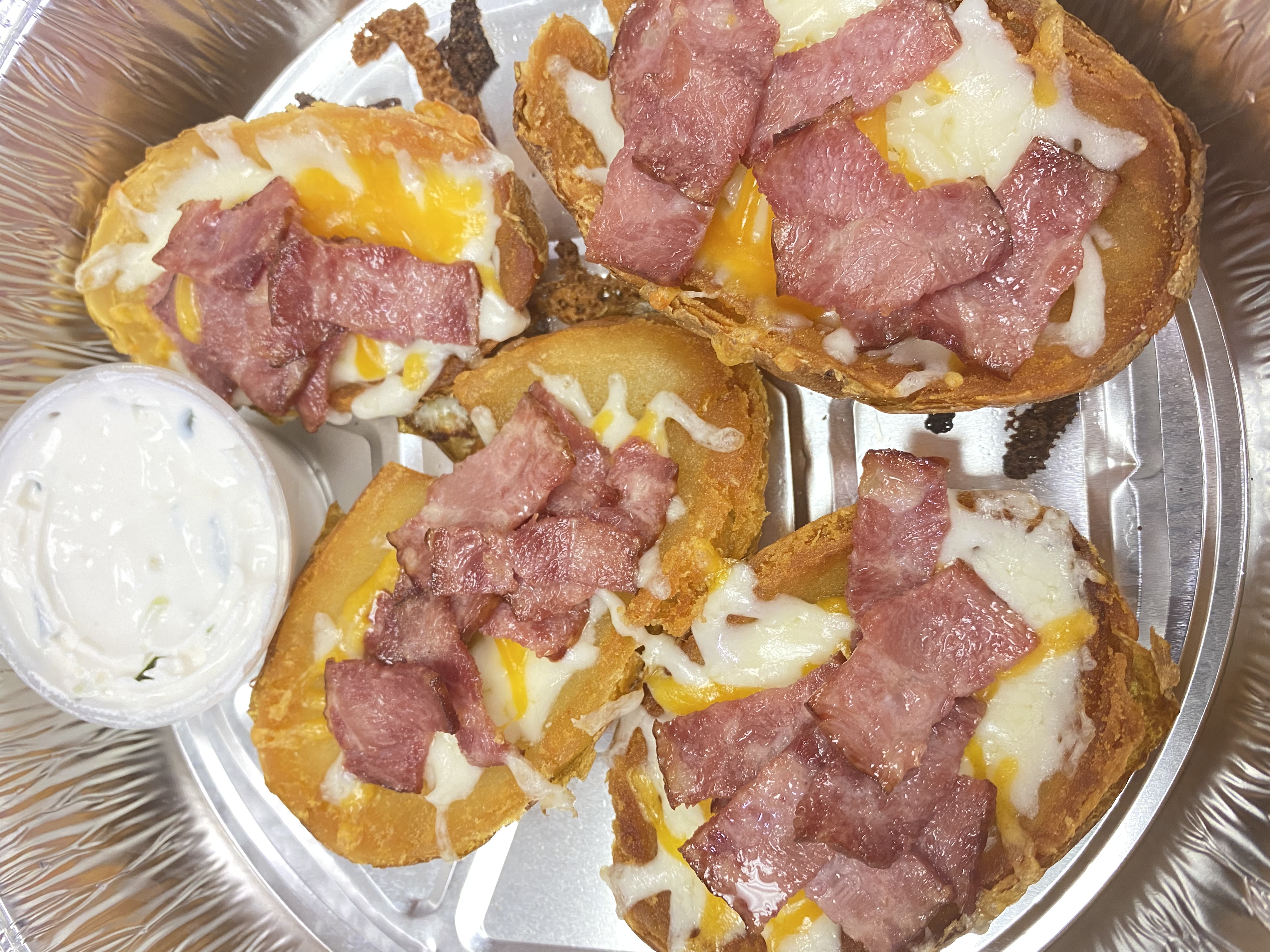 Order Potato skin with bacon food online from Tuscan Pizza Crust store, Buffalo on bringmethat.com