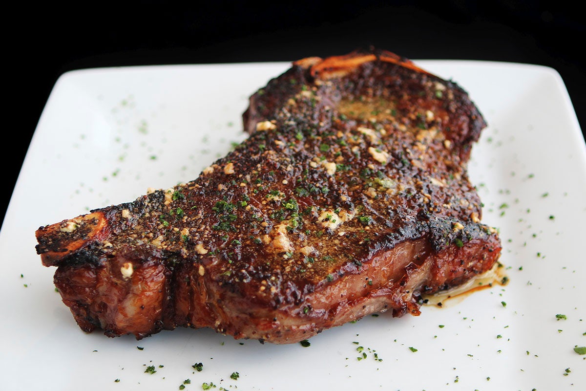 Order Prime Bone-in New York Strip, 20 OZ* | GF food online from Perry Steakhouse & Grille store, Dallas on bringmethat.com
