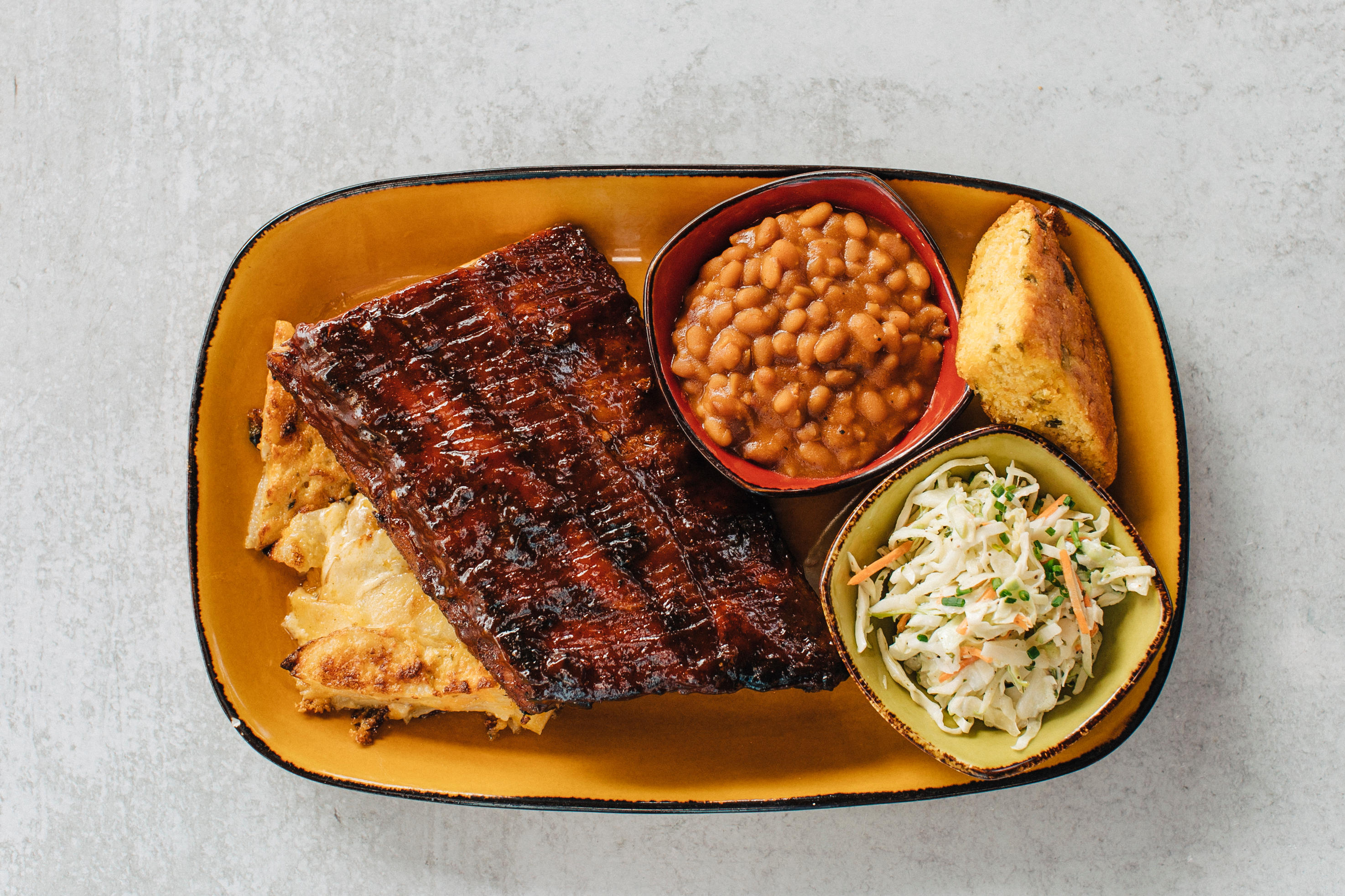 Order BBQ Baby Back Ribs Plate food online from Jimmy Famous American Tavern store, San Diego on bringmethat.com