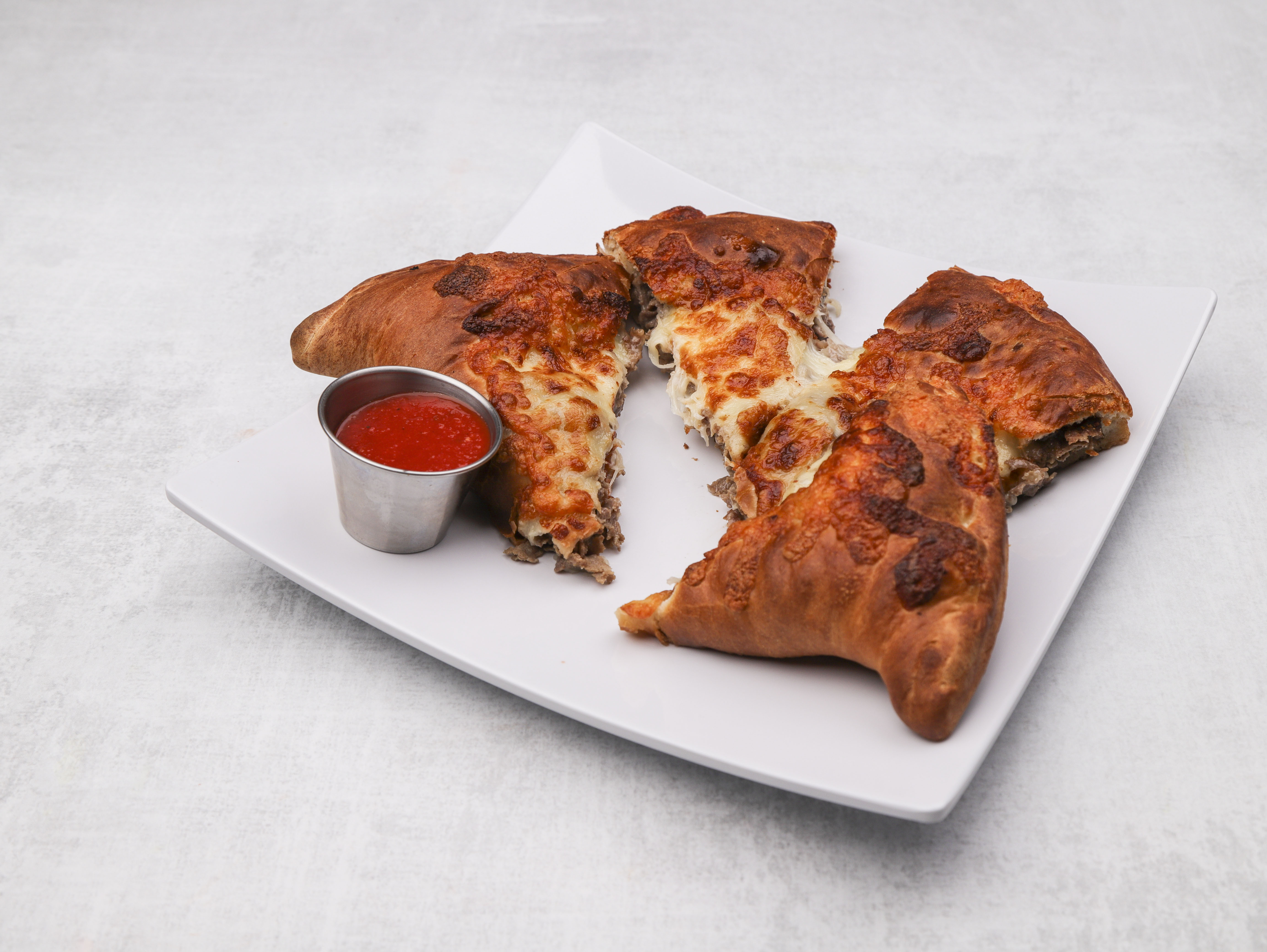 Order Steak and Cheese Calzone food online from Nick's Bistro store, Revere on bringmethat.com