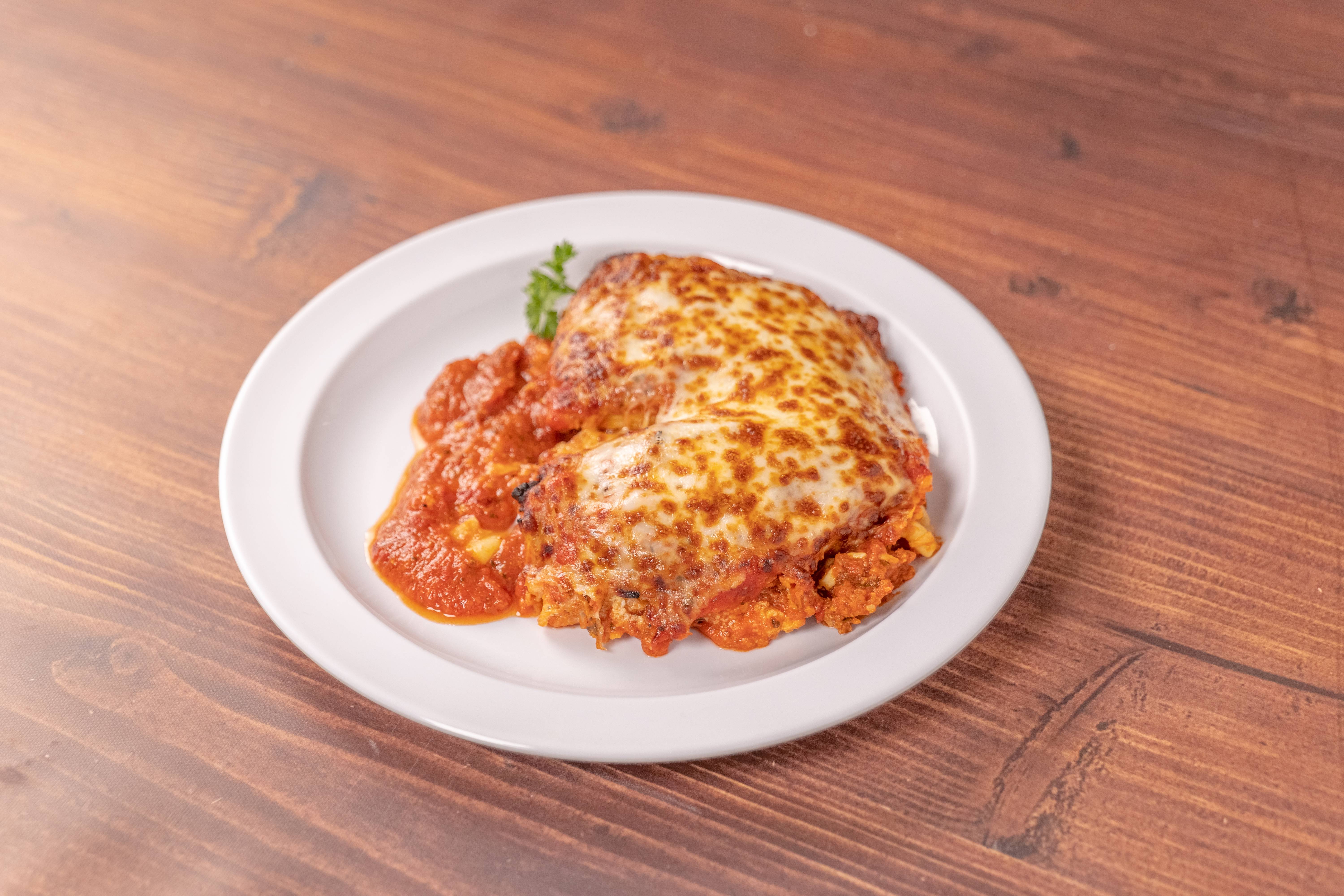 Order Lasagna food online from JC's Famous Pizza store, Reseda on bringmethat.com