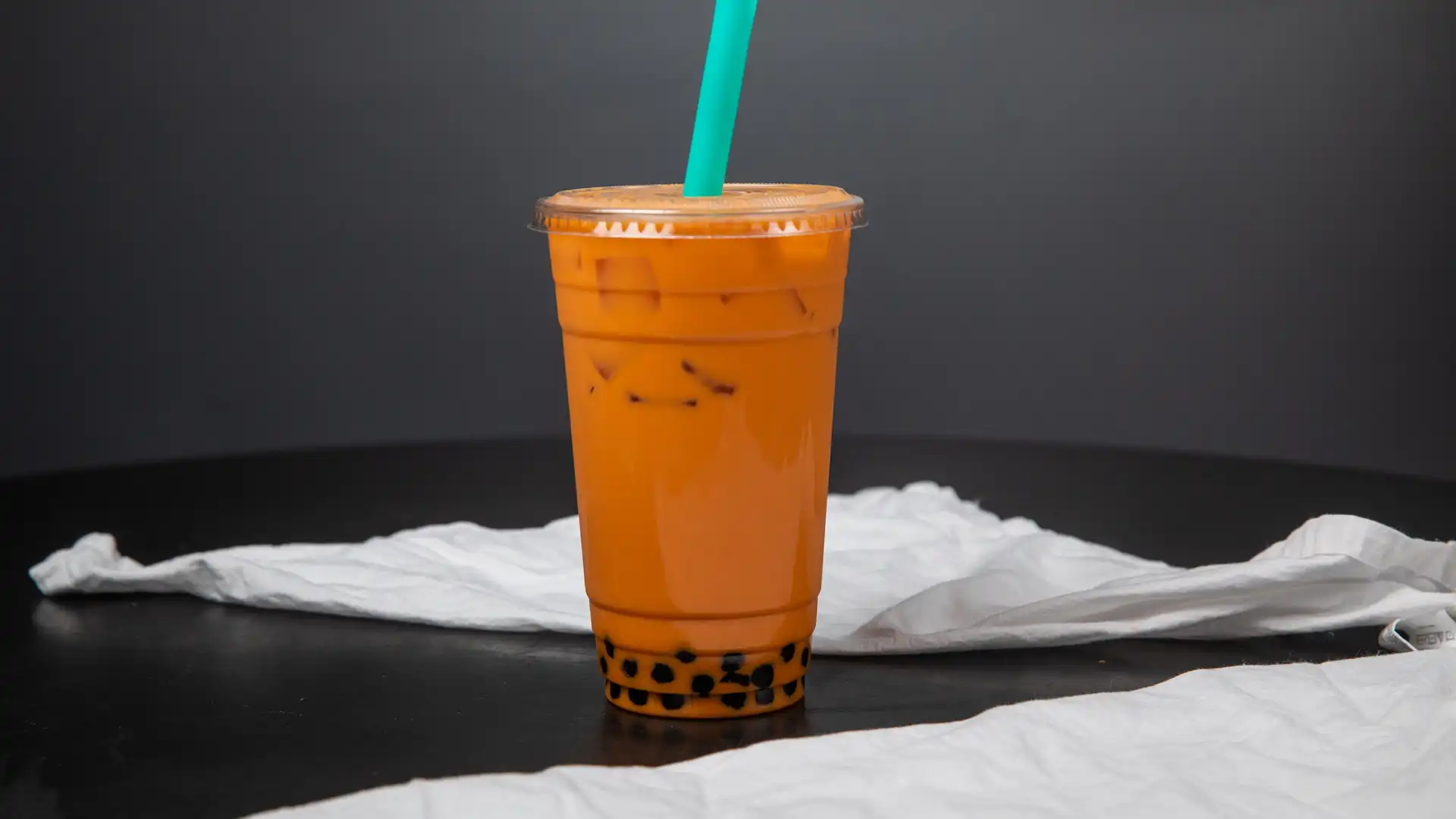 Order 24 oz. Classic Thai Tea food online from Telvet Coffee store, Forest Grove on bringmethat.com