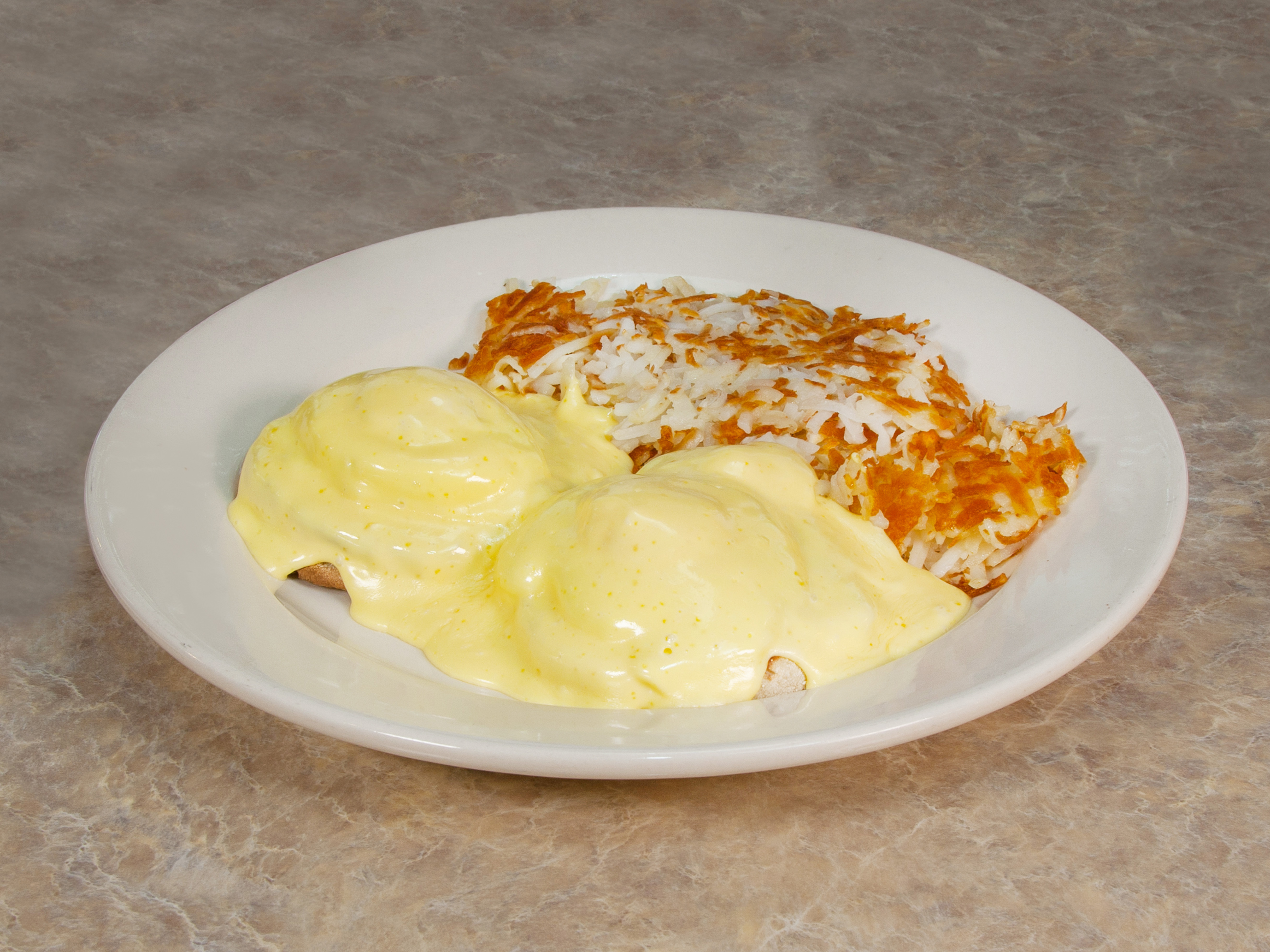 Order Traditional Eggs Benedict food online from Omega Restaurant store, Downers Grove on bringmethat.com