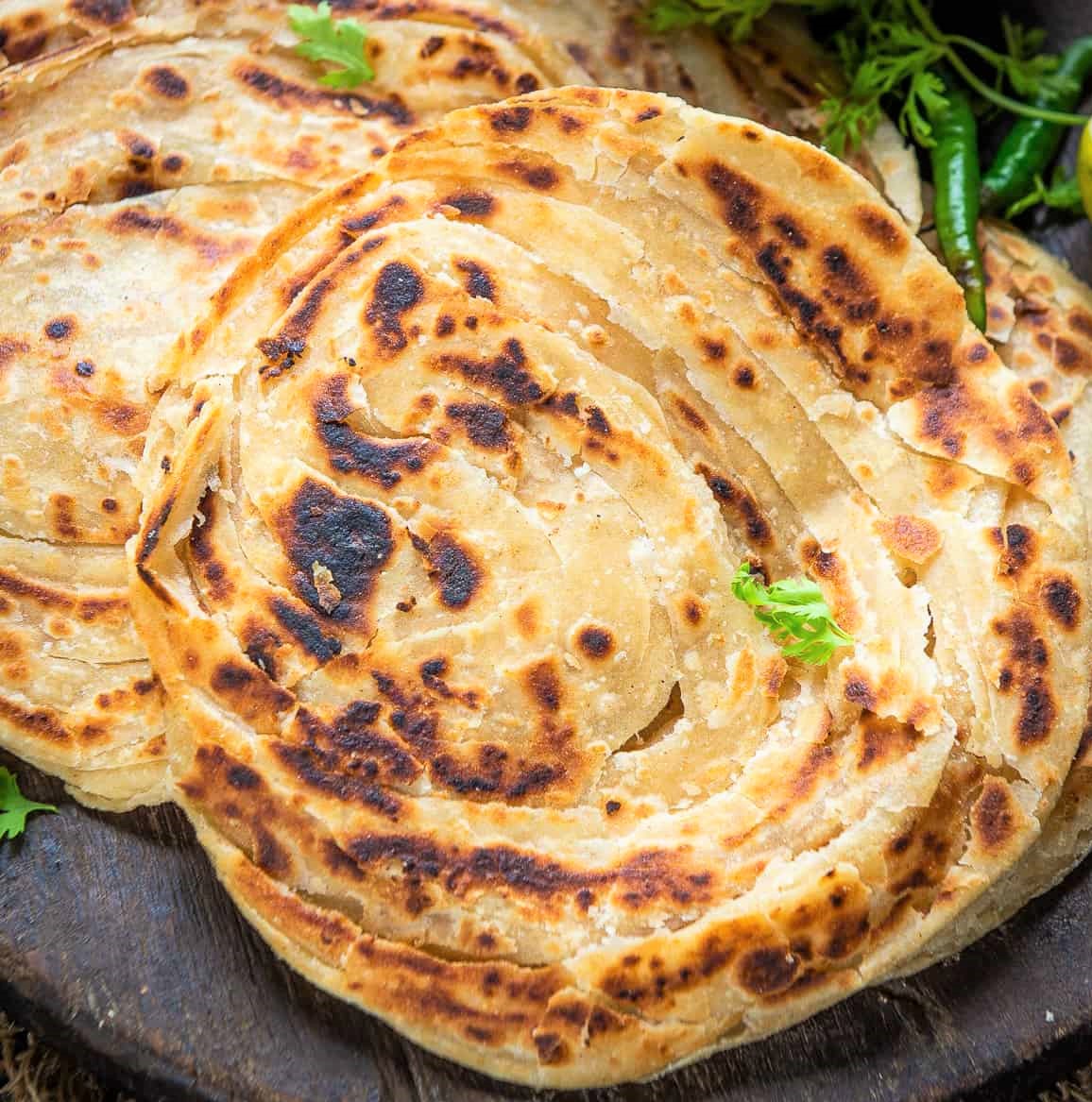Order Lachha Paratha food online from Empyrean Indian Kitchen store, Hoboken on bringmethat.com