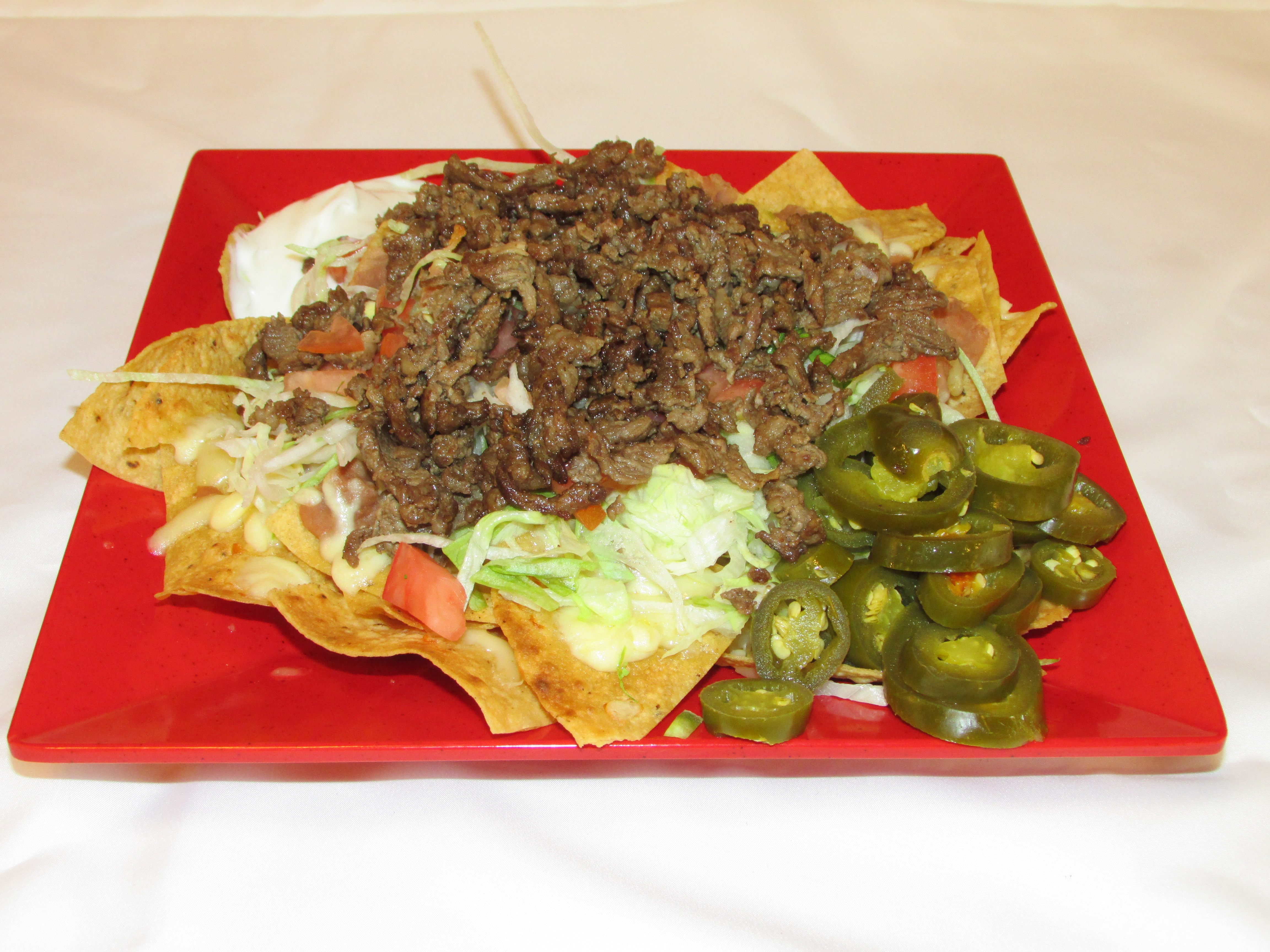Order Nachos With Meat food online from Taqueria Los Flacos store, Chicago on bringmethat.com