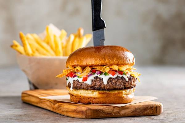 Order Queso Burger* food online from Chilis store, Highlands Ranch on bringmethat.com