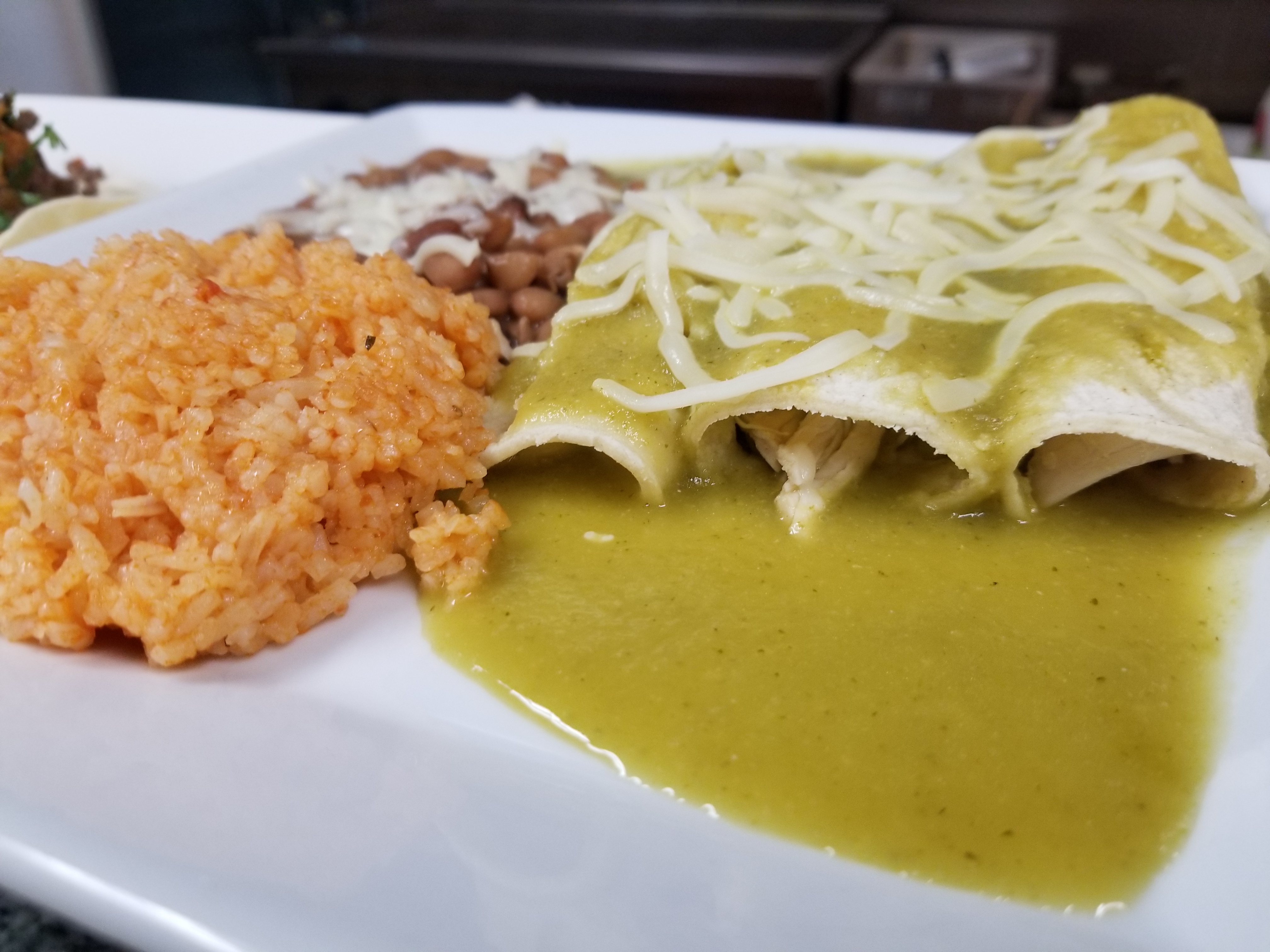 Order EGGS & CHEESE BREAKFAST ENCHILADAS SERVED WITH RICE AND BEANS food online from El Taco Chico store, Oak Park on bringmethat.com