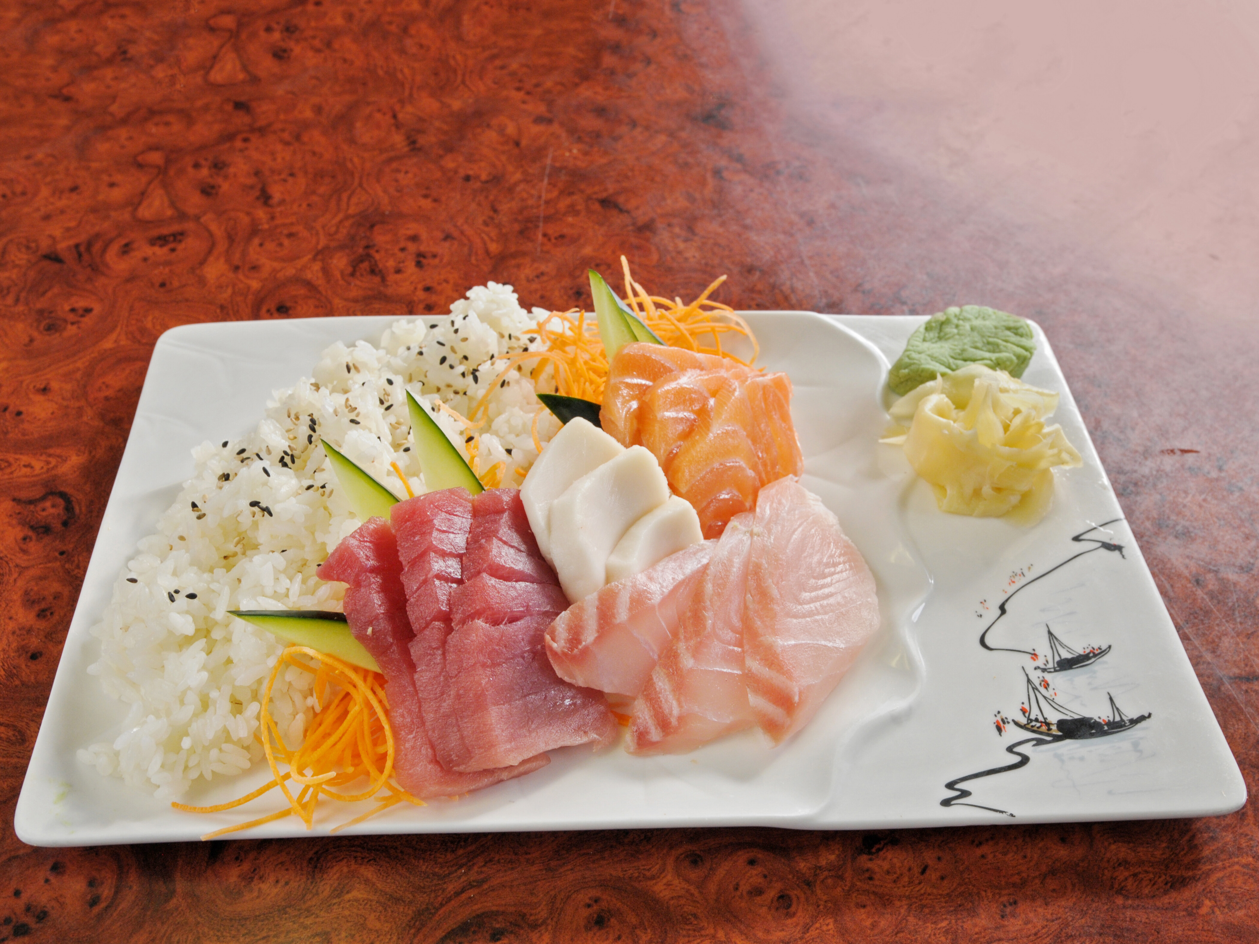 Order 12 Pcs Assorted Sashimi Over a Bed of Rice food online from Yummi Tummi store, Maplewood on bringmethat.com