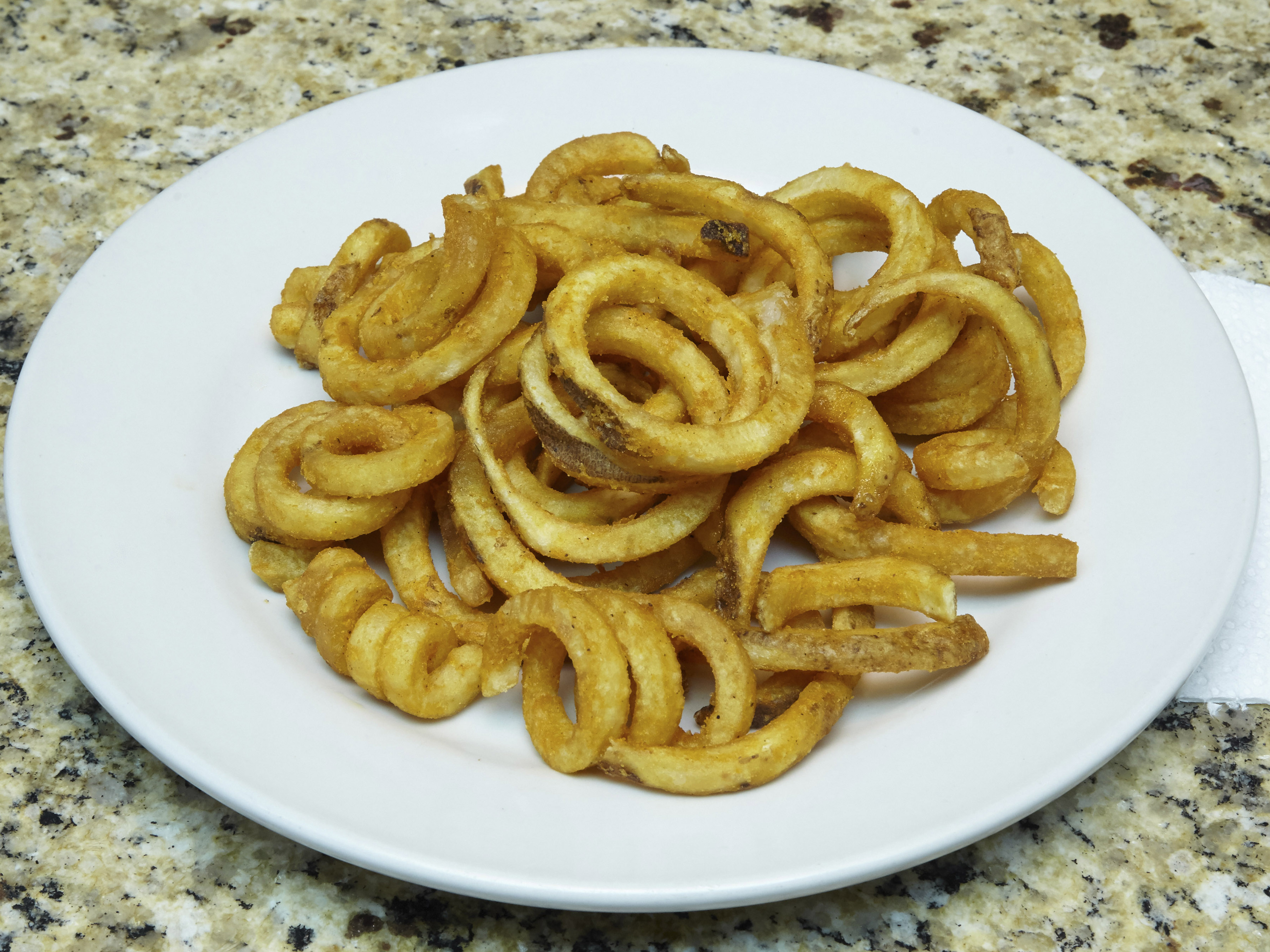 Order Curly Fries food online from East Village New Deli store, New York on bringmethat.com