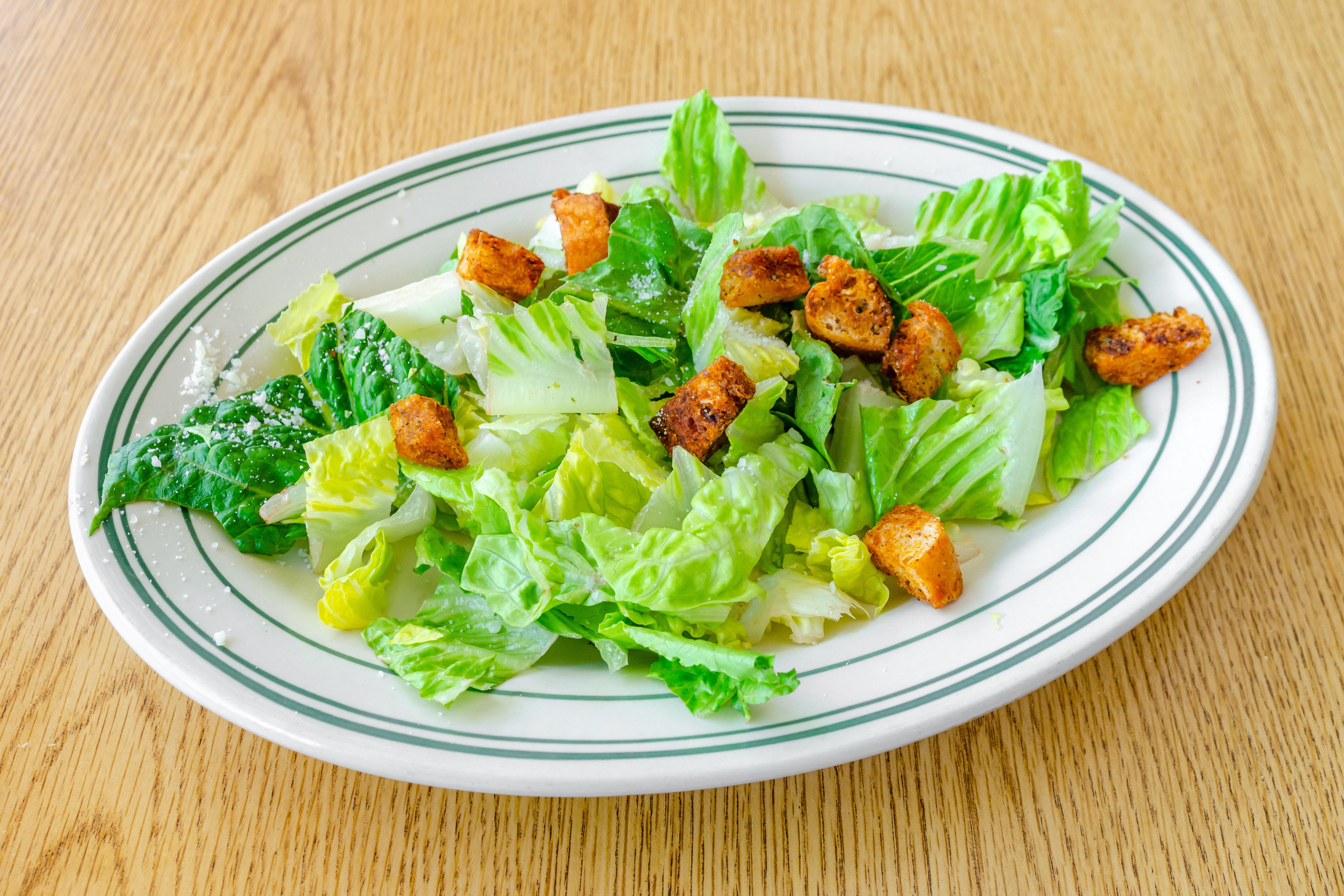 Order Caesar Salad - Salad food online from New Pizza On The Block store, West New York on bringmethat.com