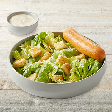 Order Caesar Salad food online from TGI Fridays store, Massapequa Park on bringmethat.com