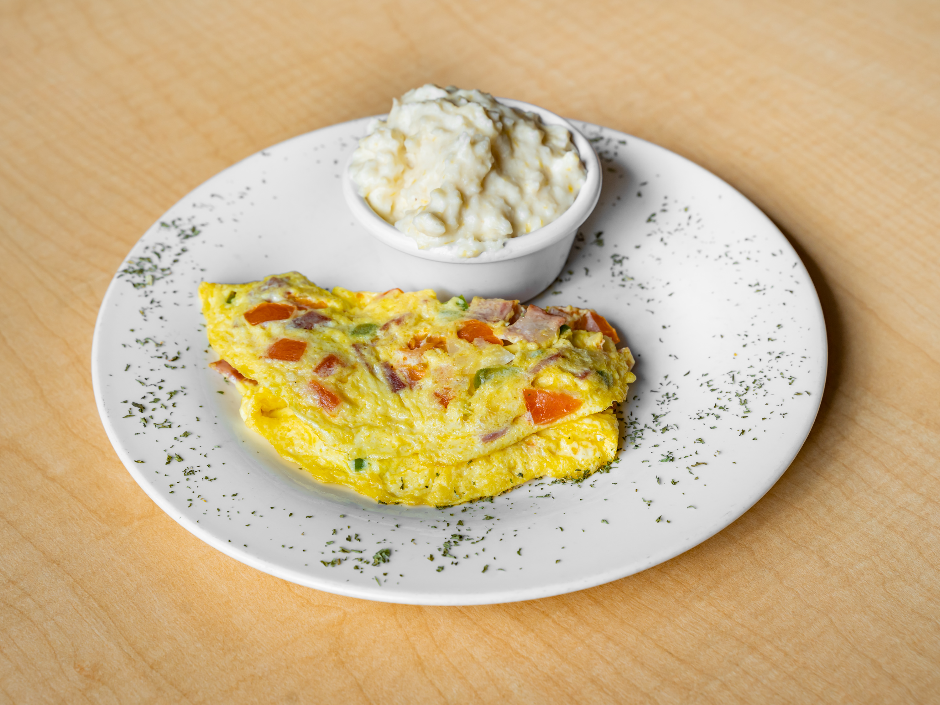Order Western Omelet with house grits   food online from Amari's Restaurant store, Philadelphia on bringmethat.com