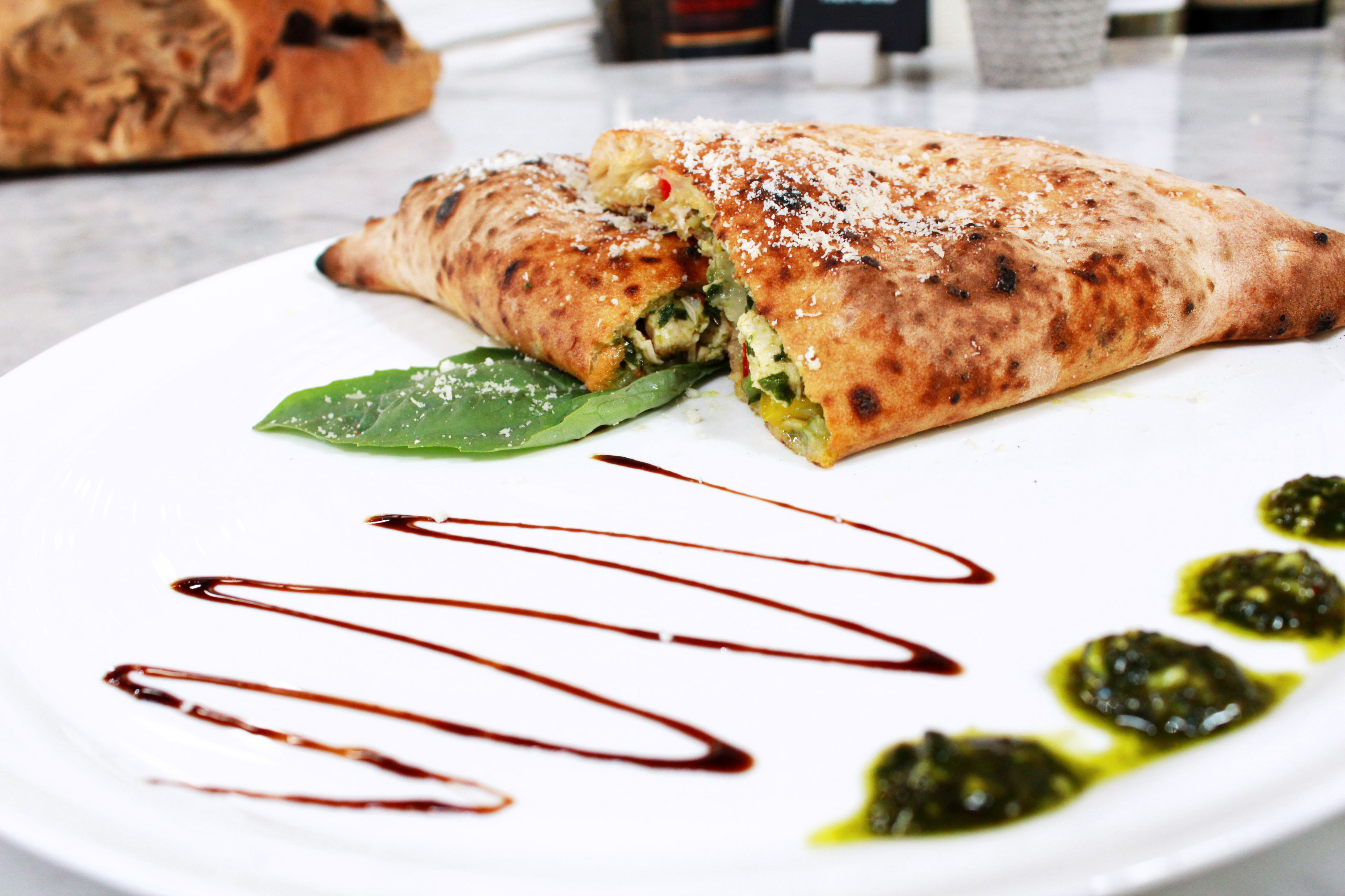 Order The Chicken Pesto Calzone food online from Stone Fire Pizza By Midici store, Modesto on bringmethat.com
