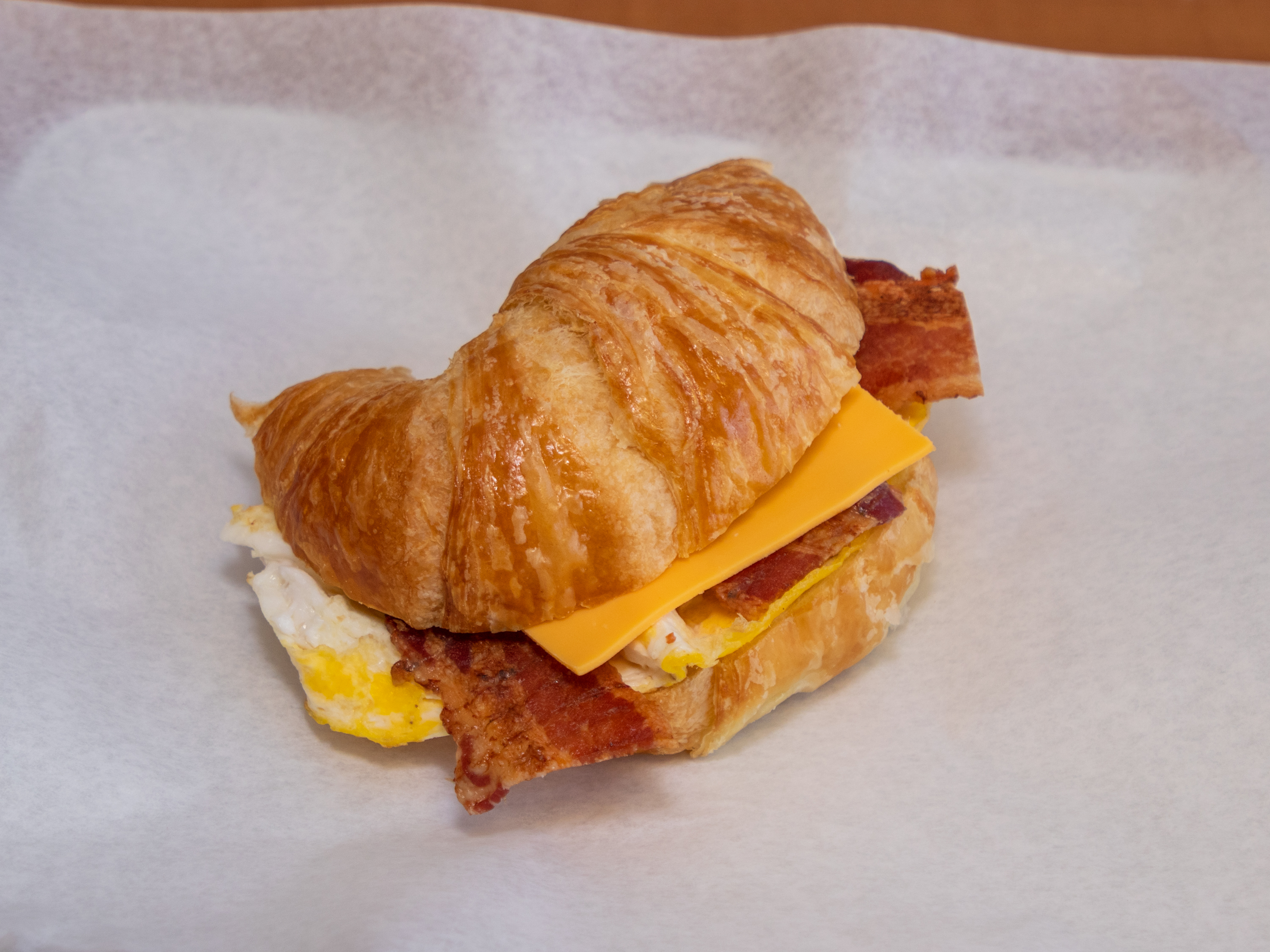 Order Bacon, Egg & Cheese Croissant food online from Donuts Coffee store, Las Vegas on bringmethat.com