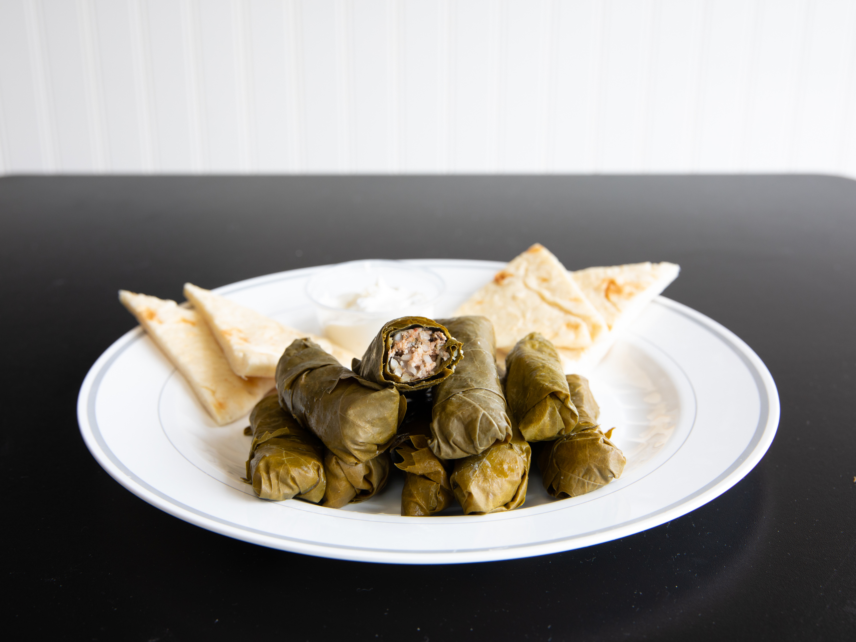 Order Stuffed Grapeleaves Specialty food online from Uncle Nick's Greek Fried Chicken store, Austintown on bringmethat.com