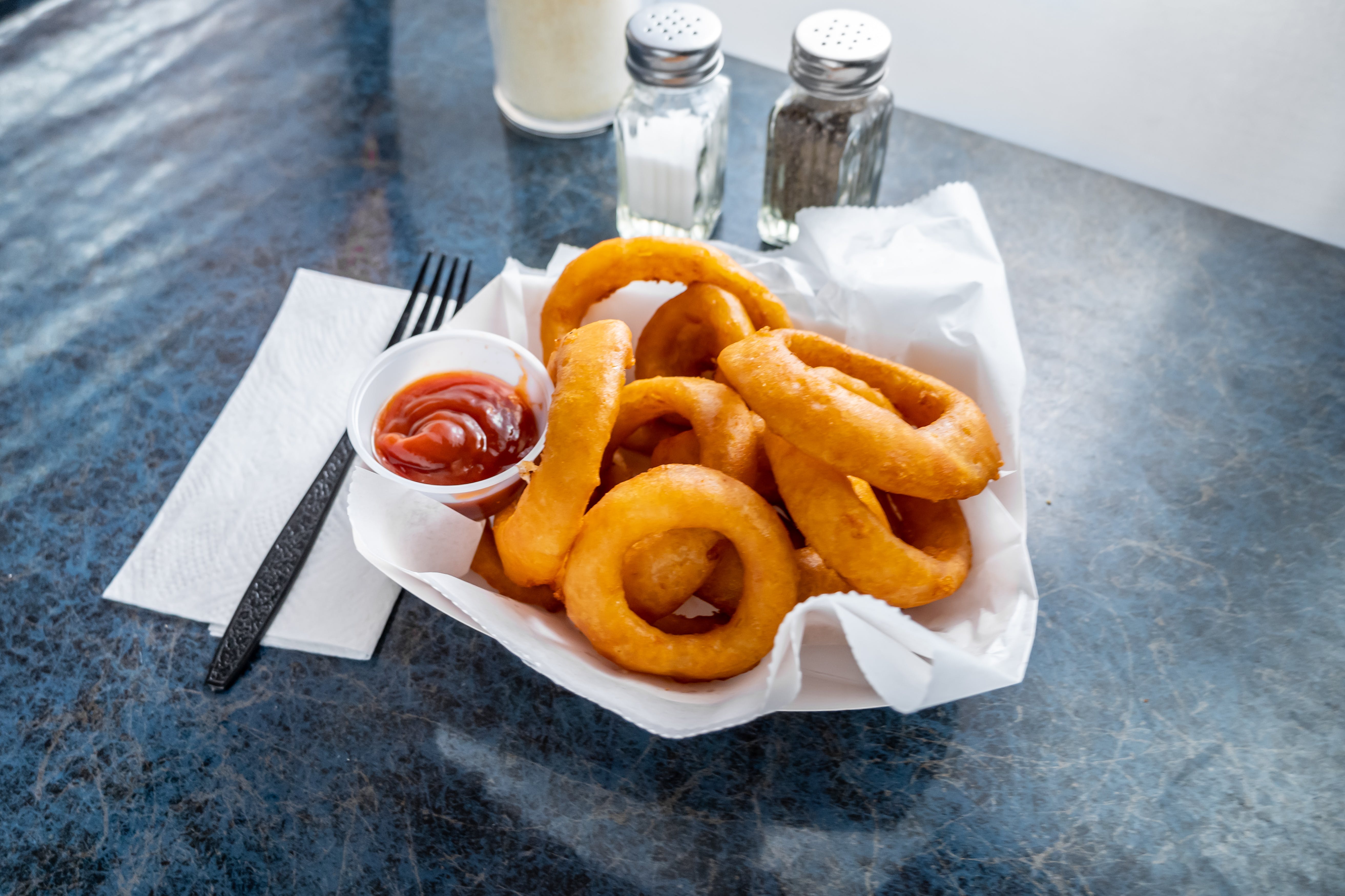Order Onion Rings - Appetizer food online from Marzella's Pizza store, Collegeville on bringmethat.com