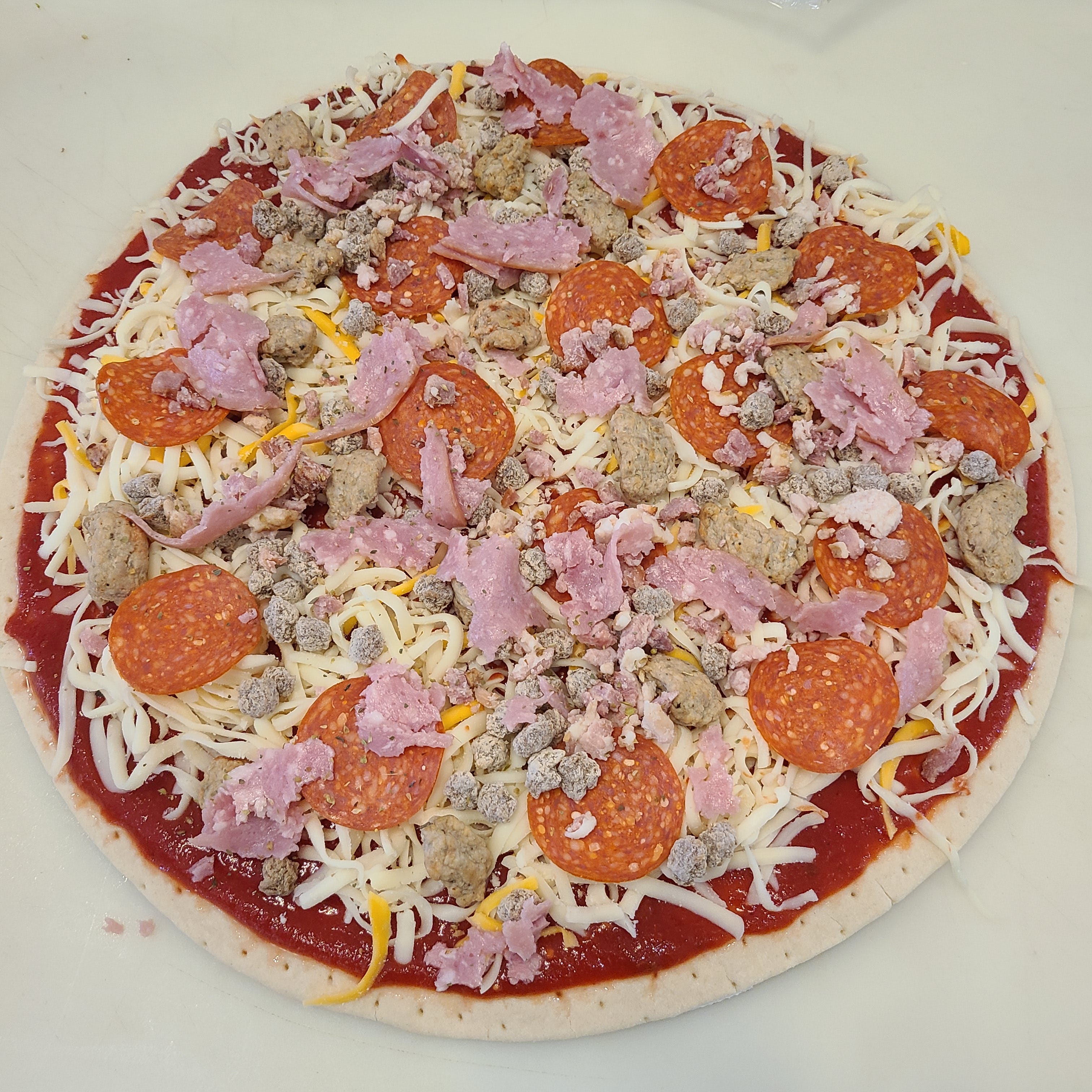 Order Meat Lover's Take & Bake Pizza - 10'' (Serves 1-2) food online from Timber Creek Pizza store, Lake Mills on bringmethat.com