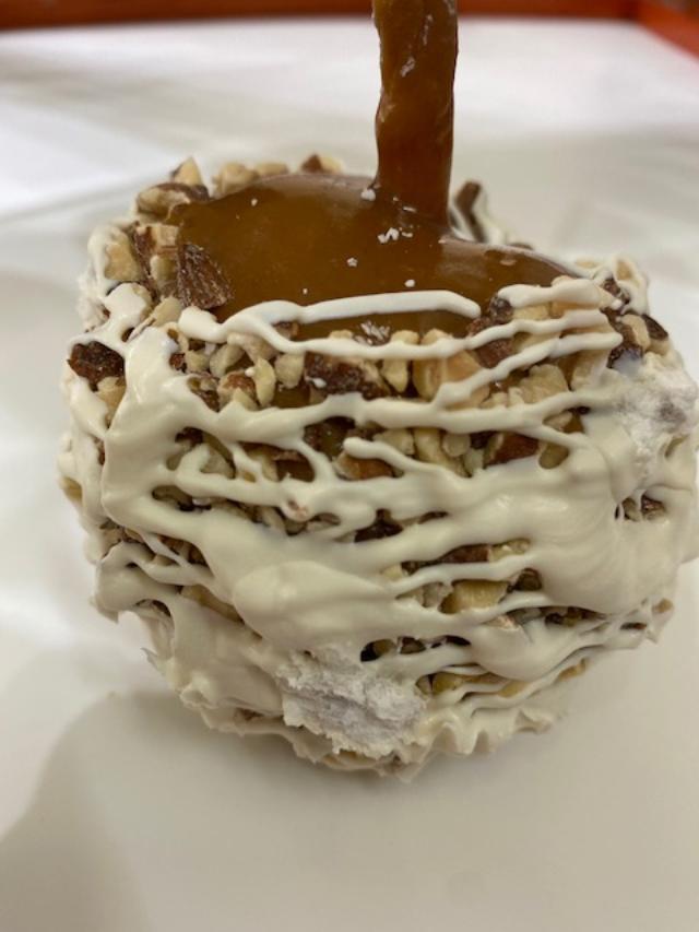 Order Almond Caramel Apple with White Confection food online from Rocky Mountain Chocolate Factory store, Redondo Beach on bringmethat.com