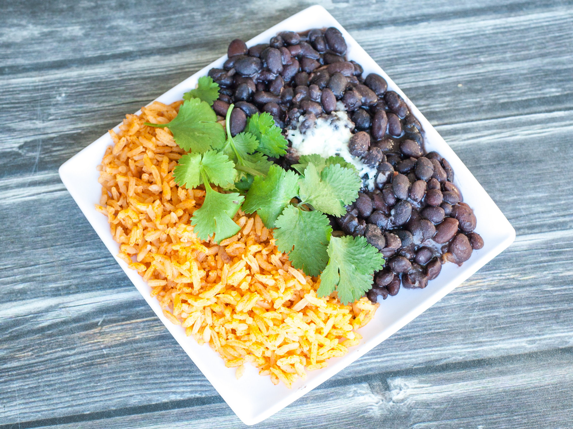Order Side of Rice and Beans food online from Blue Coyote Grill store, Palm Springs on bringmethat.com
