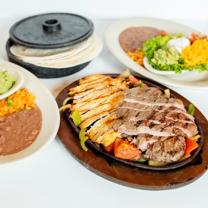 Order Sizzling Combo Fajitas food online from El Fenix Mexican Restaurant store, Greenville on bringmethat.com