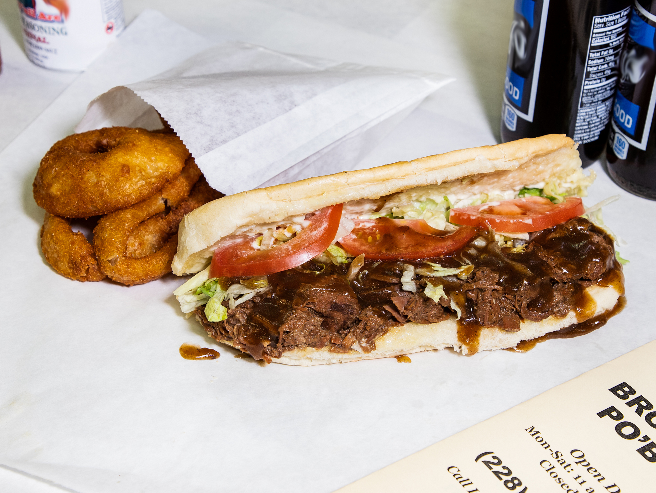 Order 16" Pot Roast NOLA Style Po'Boy food online from Quave Brothers Poboys and Meat Market store, Diberville on bringmethat.com