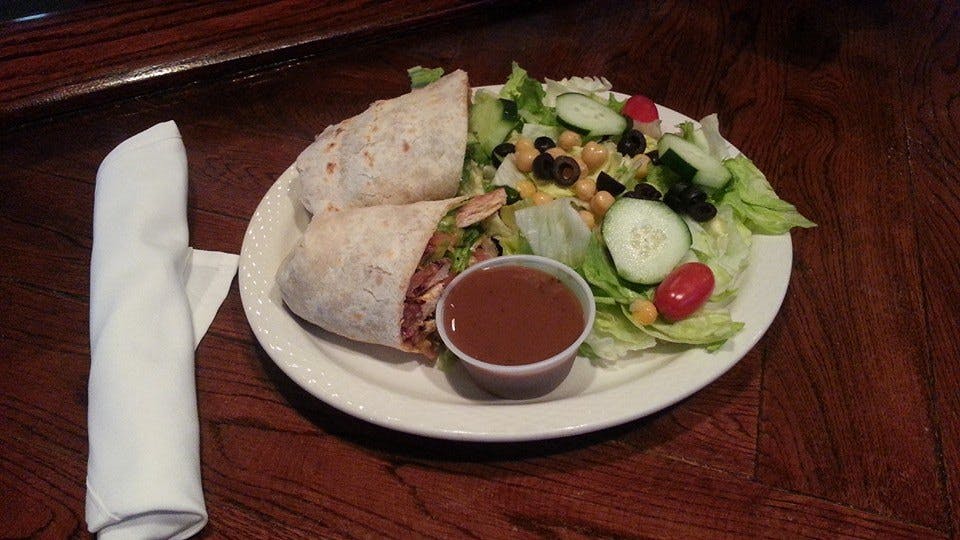 Order Chicken Caesar Wrap - 10" food online from Vazzy's 19th Hole store, Fairfield on bringmethat.com