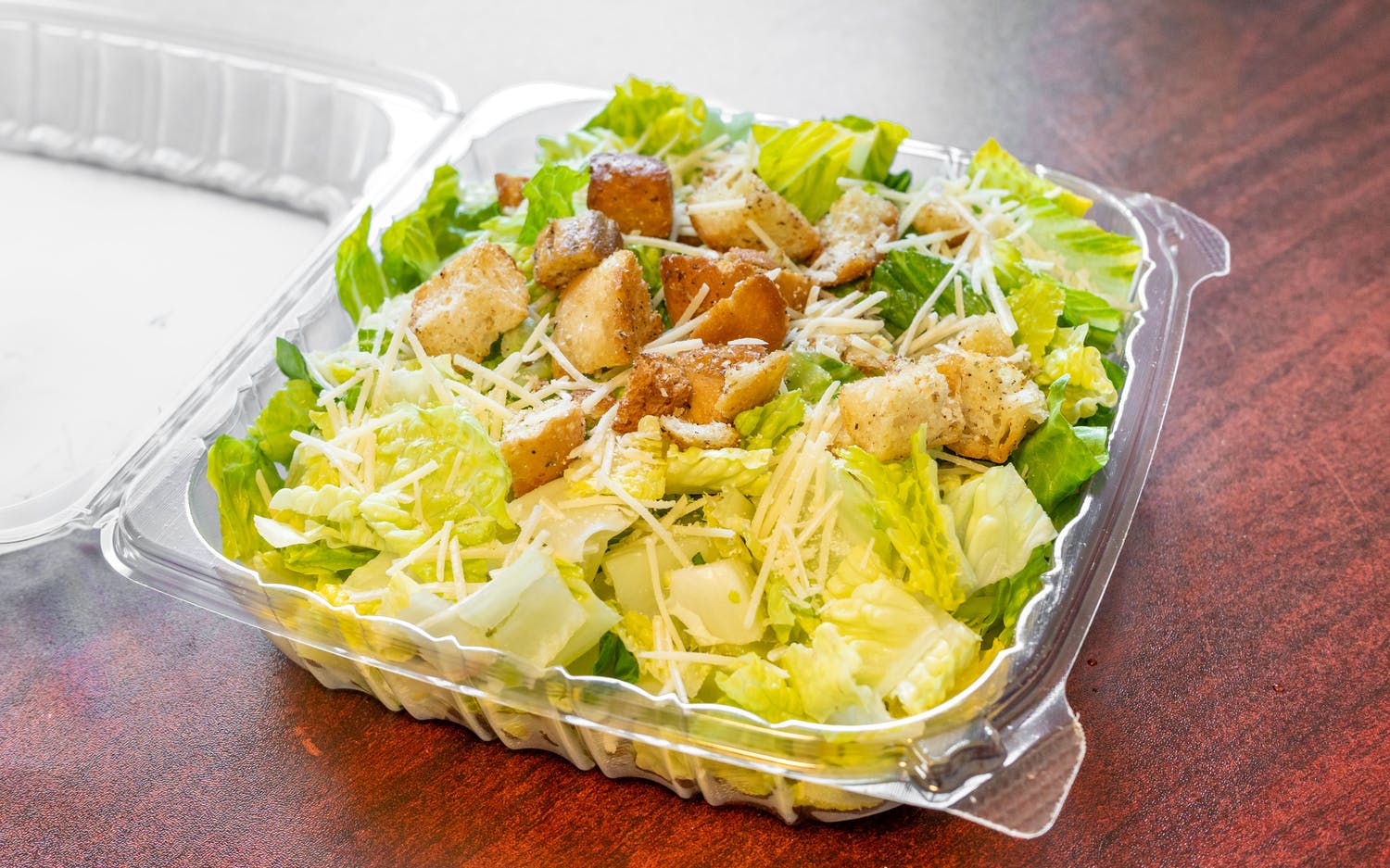 Order Caesar Salad food online from Broadway Pizza and Grill store, Norwood on bringmethat.com