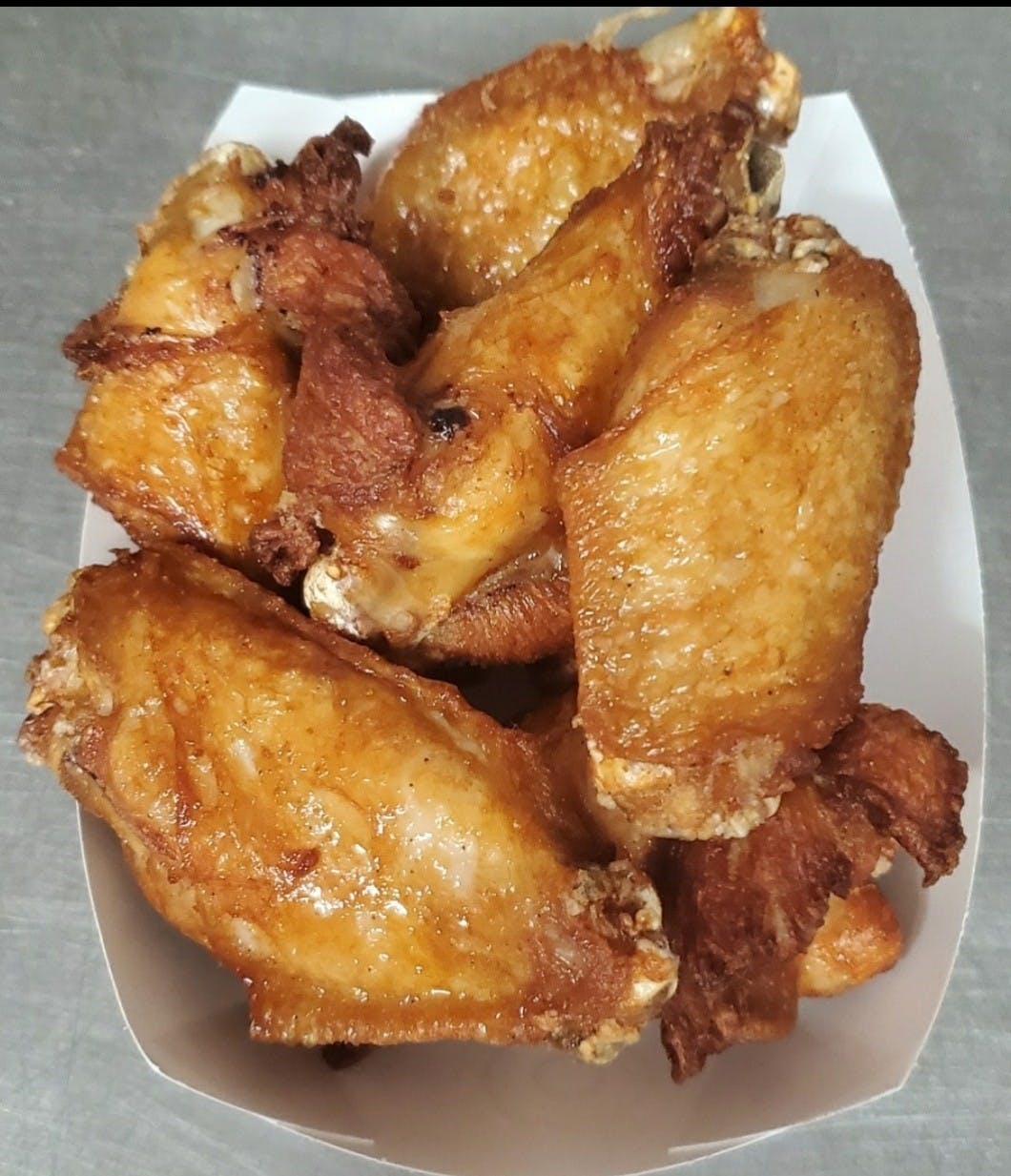 Order Bone In Wings - (7 Pieces) food online from Northside Pizza store, Hastings on bringmethat.com