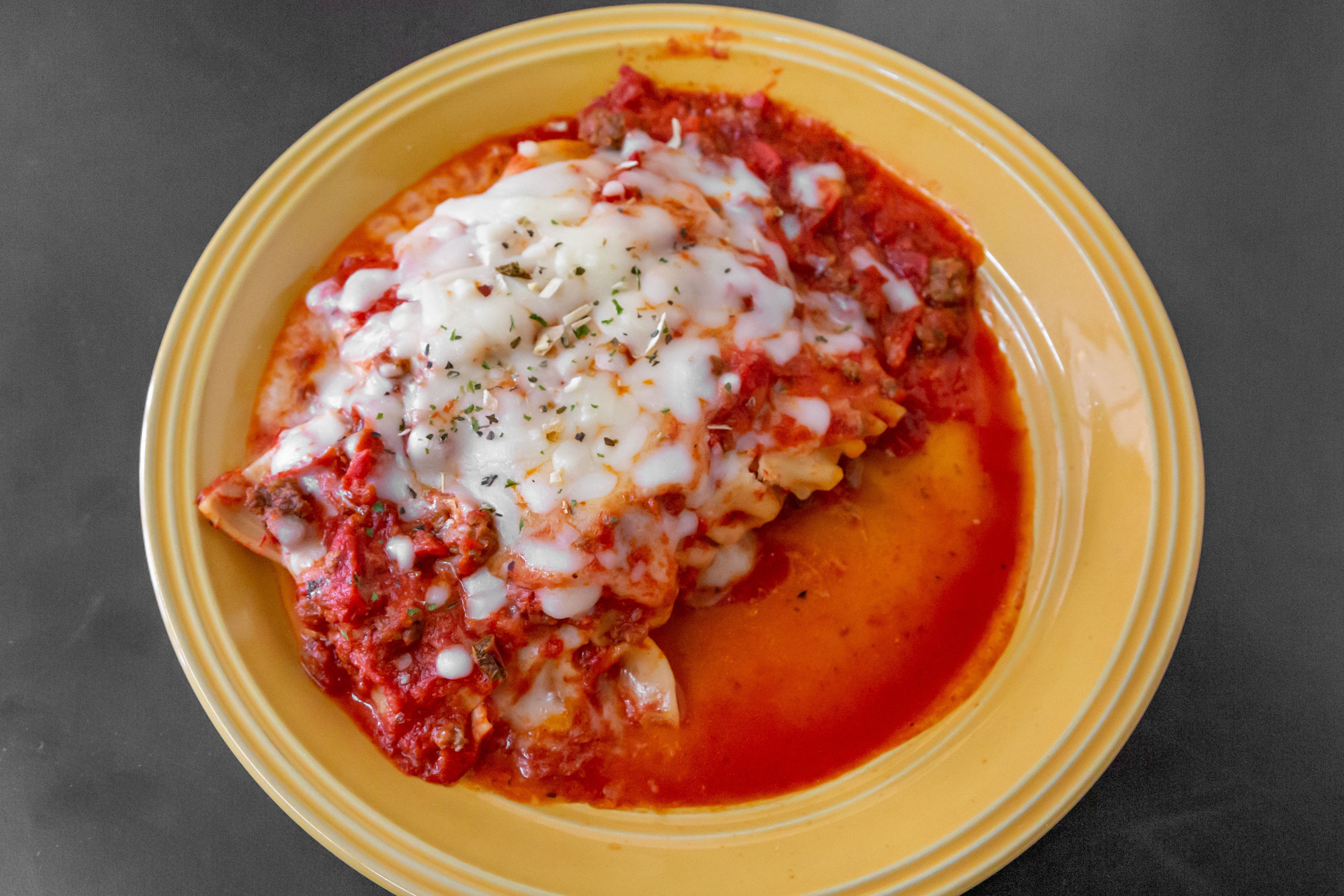Order Lasagna - Pasta food online from New York Pizzeria & Catering store, Dobson on bringmethat.com