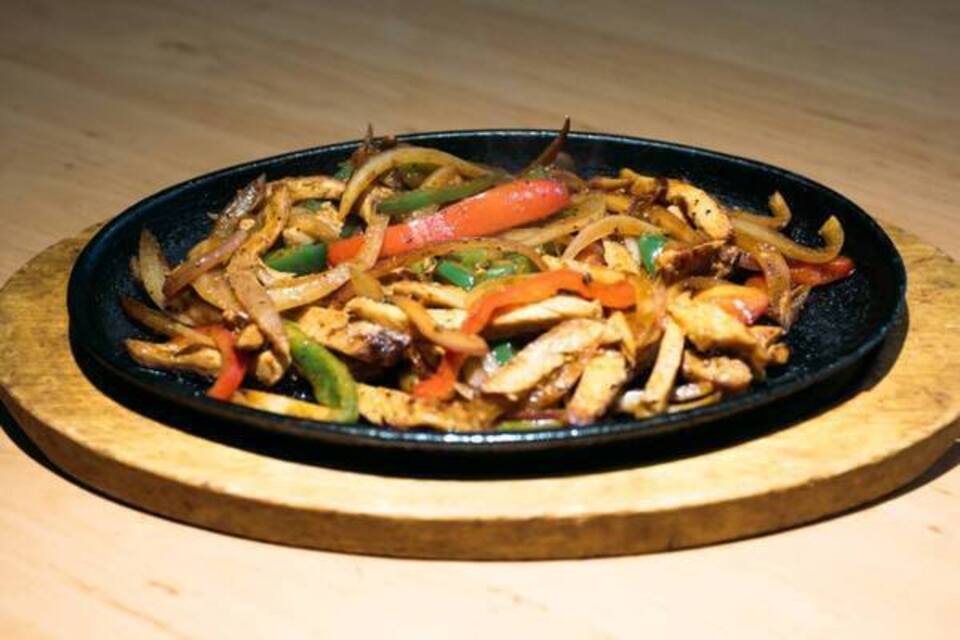 Order Fajitas Plate food online from Guacamole Authentic Mexican Grill store, Concord on bringmethat.com