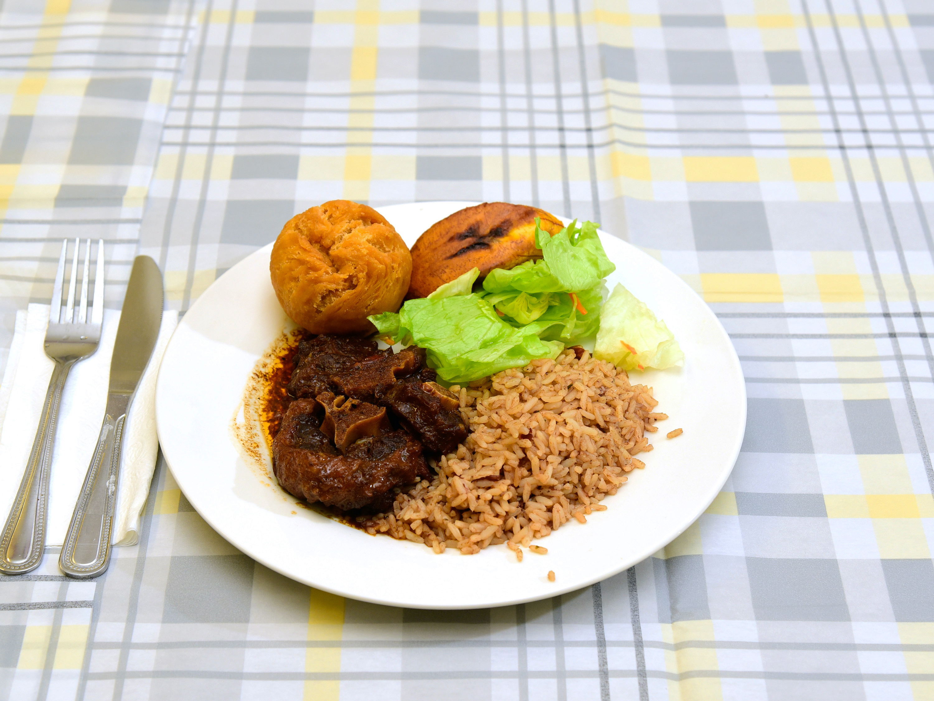 Order Oxtail food online from Yaad Style Jamaican Restaurant store, Rochester on bringmethat.com