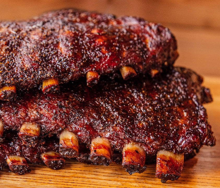 Order 1/2lb Pork Spare Ribs [aprox. 2-3 ribs] food online from Blu's Barbeque & Bbq Catering store, Dallas on bringmethat.com