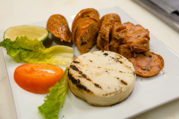 Order Chorizo con Arepa food online from Makondo Restaurant store, Port Chester on bringmethat.com