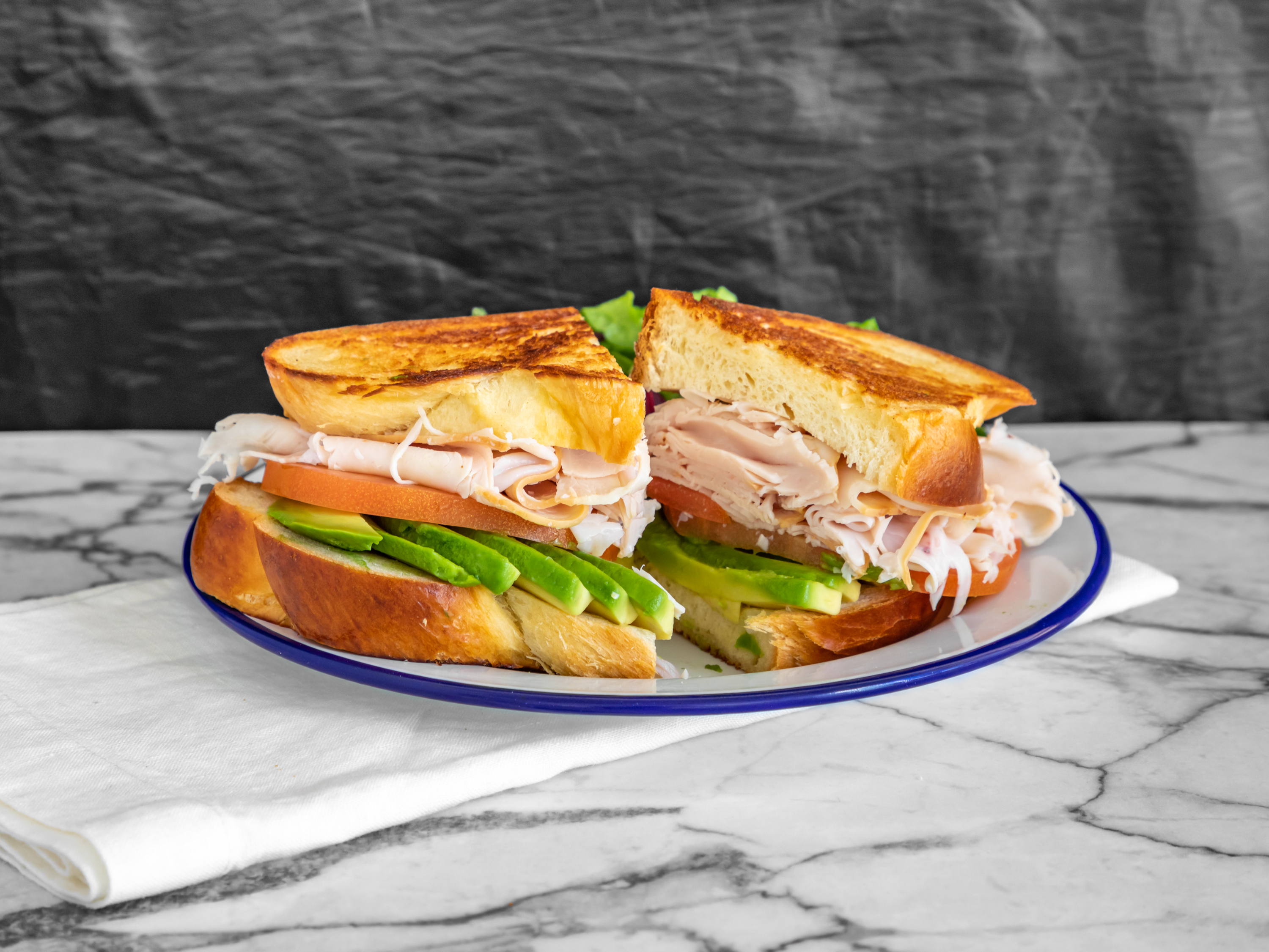 Order Turkey and Avocado Sandwich food online from Café Lovi store, Santa Monica on bringmethat.com