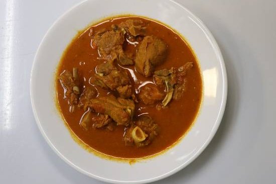 Order Goat Curry food online from Hot N Spicy Restaurant store, Irving on bringmethat.com