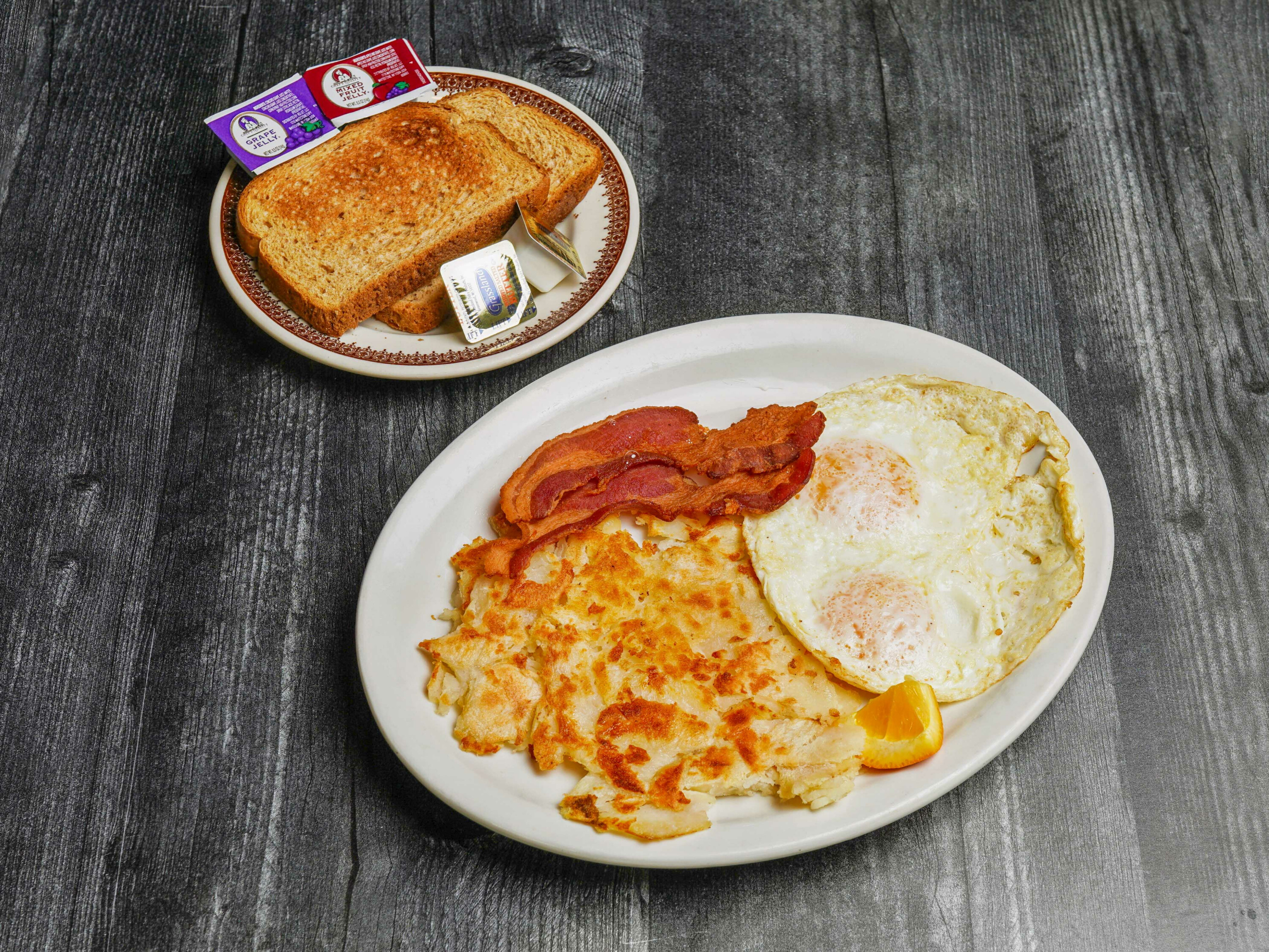 Order 11. Two Eggs, Two French Toast and Meat food online from El Chile Restaurant and Pancake House store, Chicago on bringmethat.com