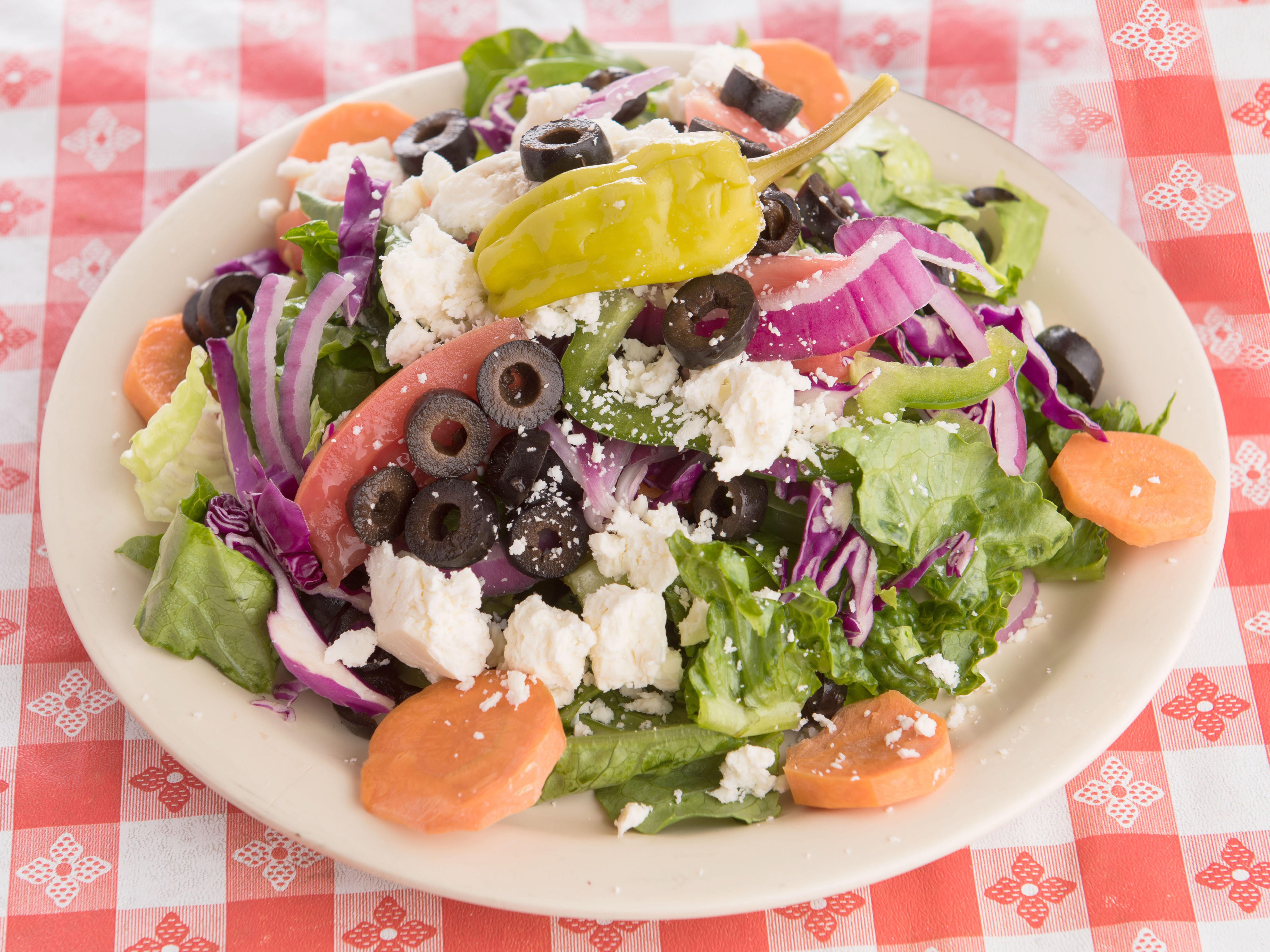 Order Greek Salad food online from Two Guys Pizzeria store, Houston on bringmethat.com