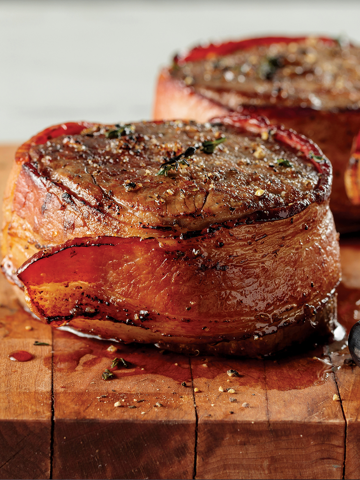 Order 4 Bacon-Wrapped Filet Mignons (5 oz.) food online from Omaha Steaks store, Denver on bringmethat.com