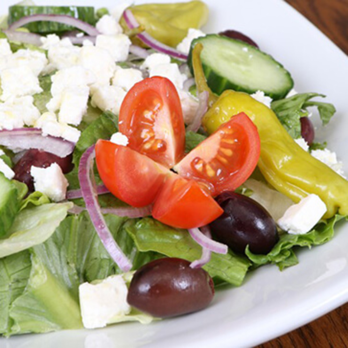 Order Greek Salad food online from Mario's Pizza store, Winston Salem on bringmethat.com