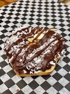 Order Almond Joy Donut food online from Bearscat Bakery store, Mesa on bringmethat.com